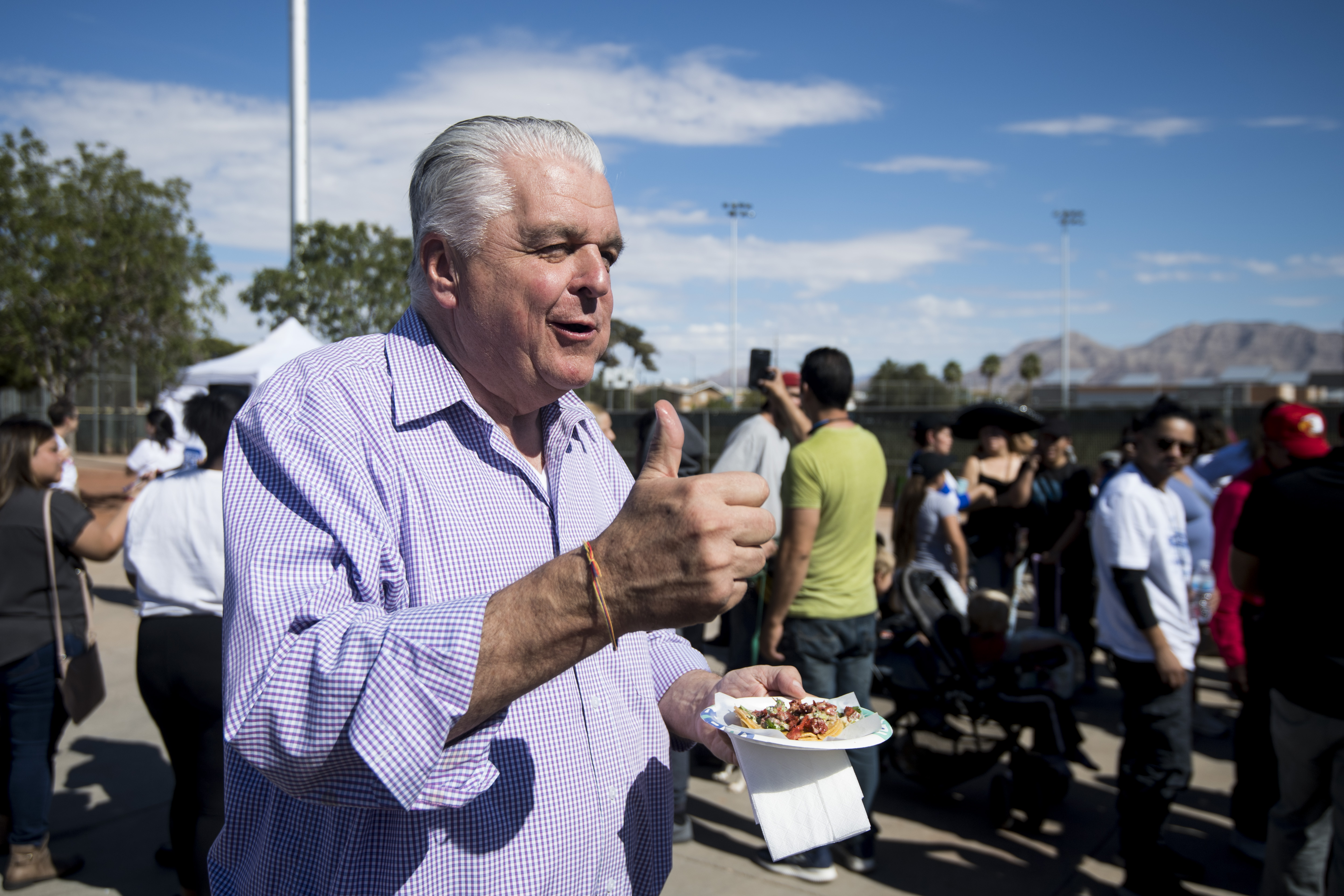 UNITED STATES - OCTOBER 20: Clark County Commission Chairman Steve Sisolak, candidate for Nevada governor, gives a thumbs up after tasting a taco at the East Las Vegas Community Center, an early voting location, in Las Vegas on Saturday, Oct. 20, 2018, the first day of early voting in Nevada. (Photo By Bill Clark/CQ Roll Call)