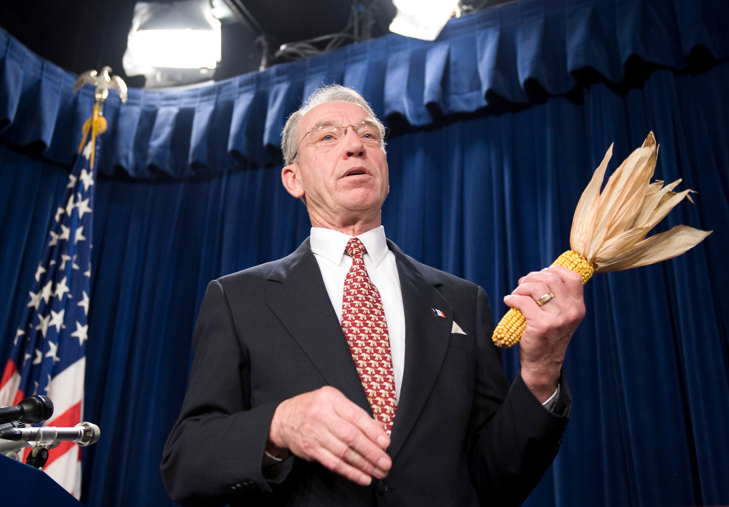 Sen. Chuck Grassley, R-Iowa, holds an ear of corn in 2008. As industry groups have lobbied the Trump administration to rethink the Renewable Fuel Standard, lawmakers in the corn belt have applied pressure too. (CQ Roll Call file photo)