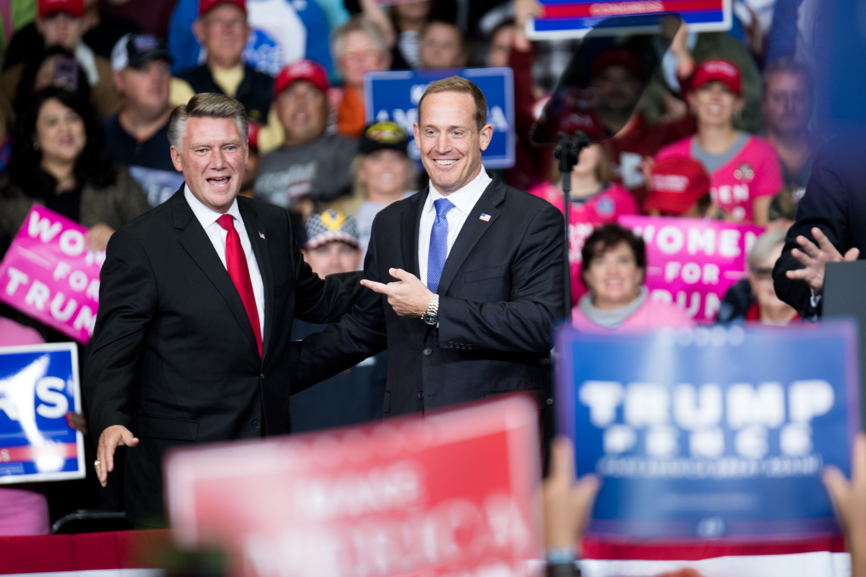 Baptist minister Mark Harris (left), who is seeking election in North Carolina’s 9th district, and Rep. Ted Budd , R-N.C., are introduced by President Donald Trump during an October campaign rally in Charlotte. (Sean Rayford/Getty Images file photo)