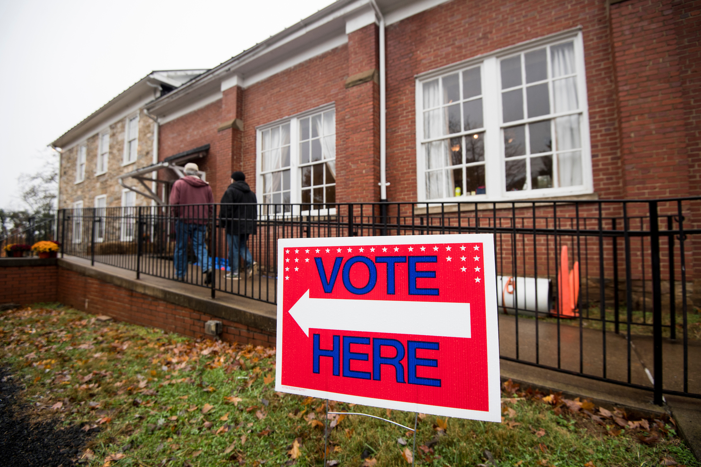 Voters arrive at the Old Stone School polling location as a light rain falls in Hillsboro, Va., on Election Day. (Bill Clark/CQ Roll Call)