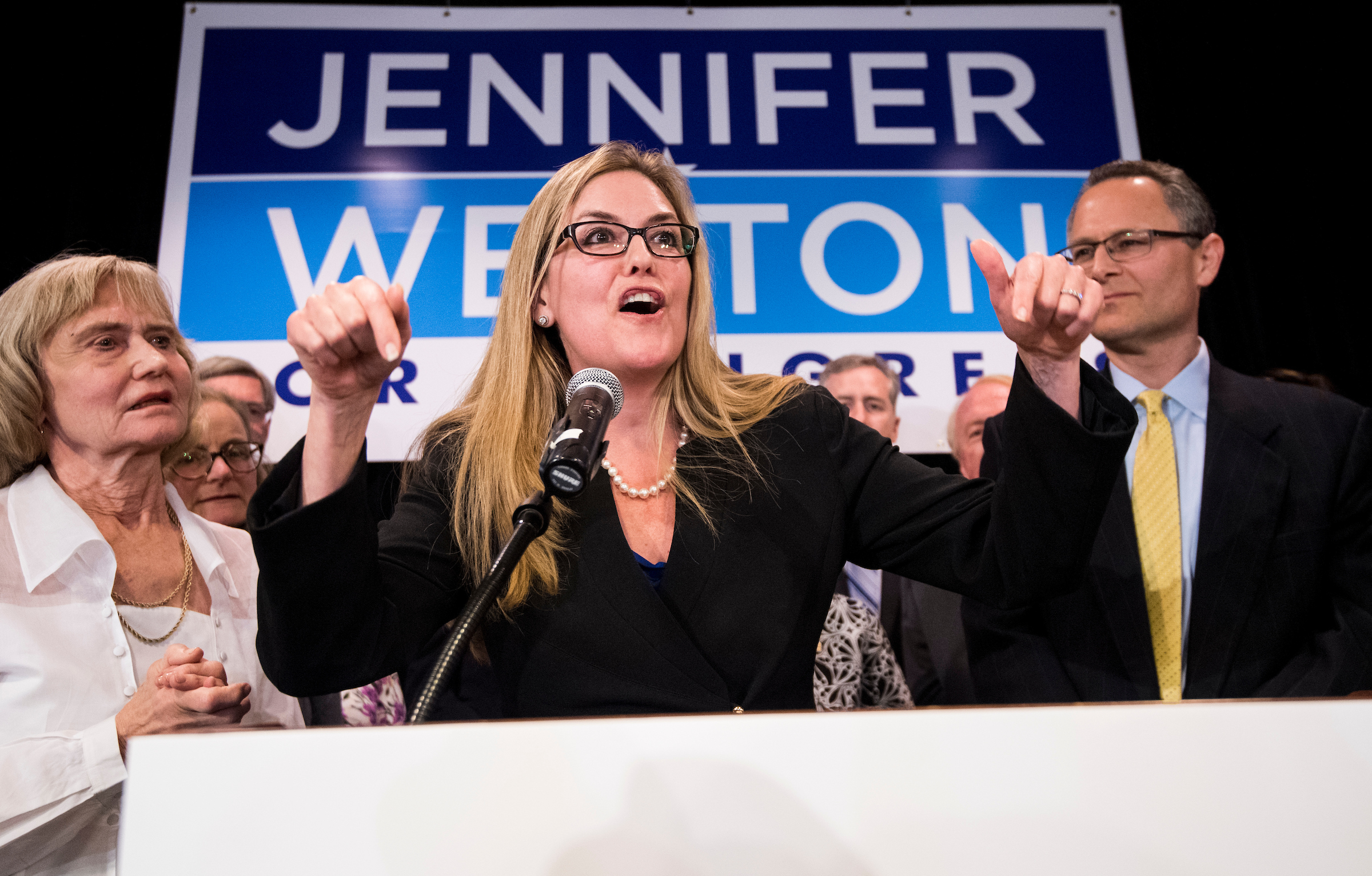 Democrat Jennifer Wexton, flanked by her mother, Paula Tosini, and husband, Andrew, delivers her victory speech Tuesday night after defeating GOP Rep. Barbara Comstock in Virginia’s 10th District. (Bill Clark/CQ Roll Call file photo)