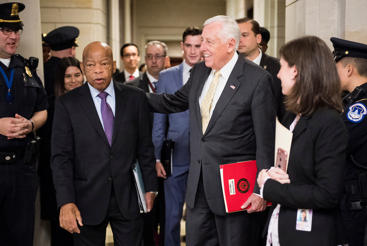 House Democrats released the legislative schedule for 2019 on Thursday. Above, Georgia Rep. John Lewis, left, and House Minority Whip Steny H. Hoyer leave the Capitol Visitor Center auditorium Wednesday during a break in the House Democrats’ leadership elections. (Bill Clark/CQ Roll Call)