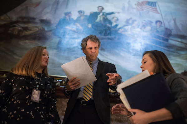 UNITED STATES - NOVEMBER 27: Sen. Sherrod Brown, D-Ohio, talks with aides before the Democratic Senate policy luncheons in the Capitol on November 27, 2018. (Photo By Tom Williams/CQ Roll Call)