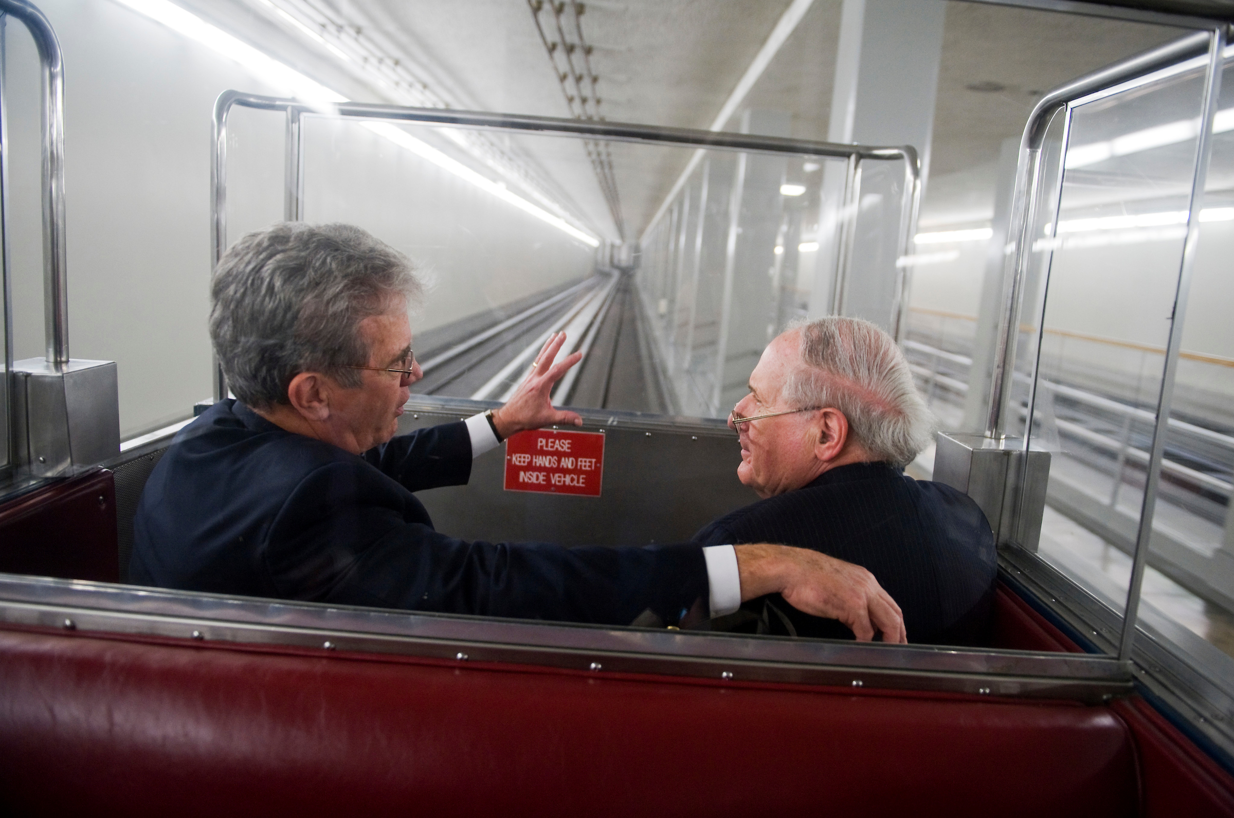 Tom Coburn, R-Okla., left, and Carl Levin, D-Mich., ride the Senate subway in 2011, when both were still in Congress. The pair led hearings on the causes of the 2008 financial crisis. (Tom Williams/Roll Call file photo)