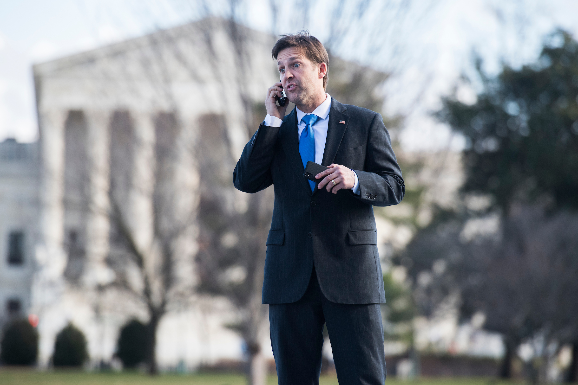 Sen. Ben Sasse, R-Neb., is seen on the Capitol's Senate steps before a procedural vote on the spending bill on Friday. (Tom Williams/CQ Roll Call)