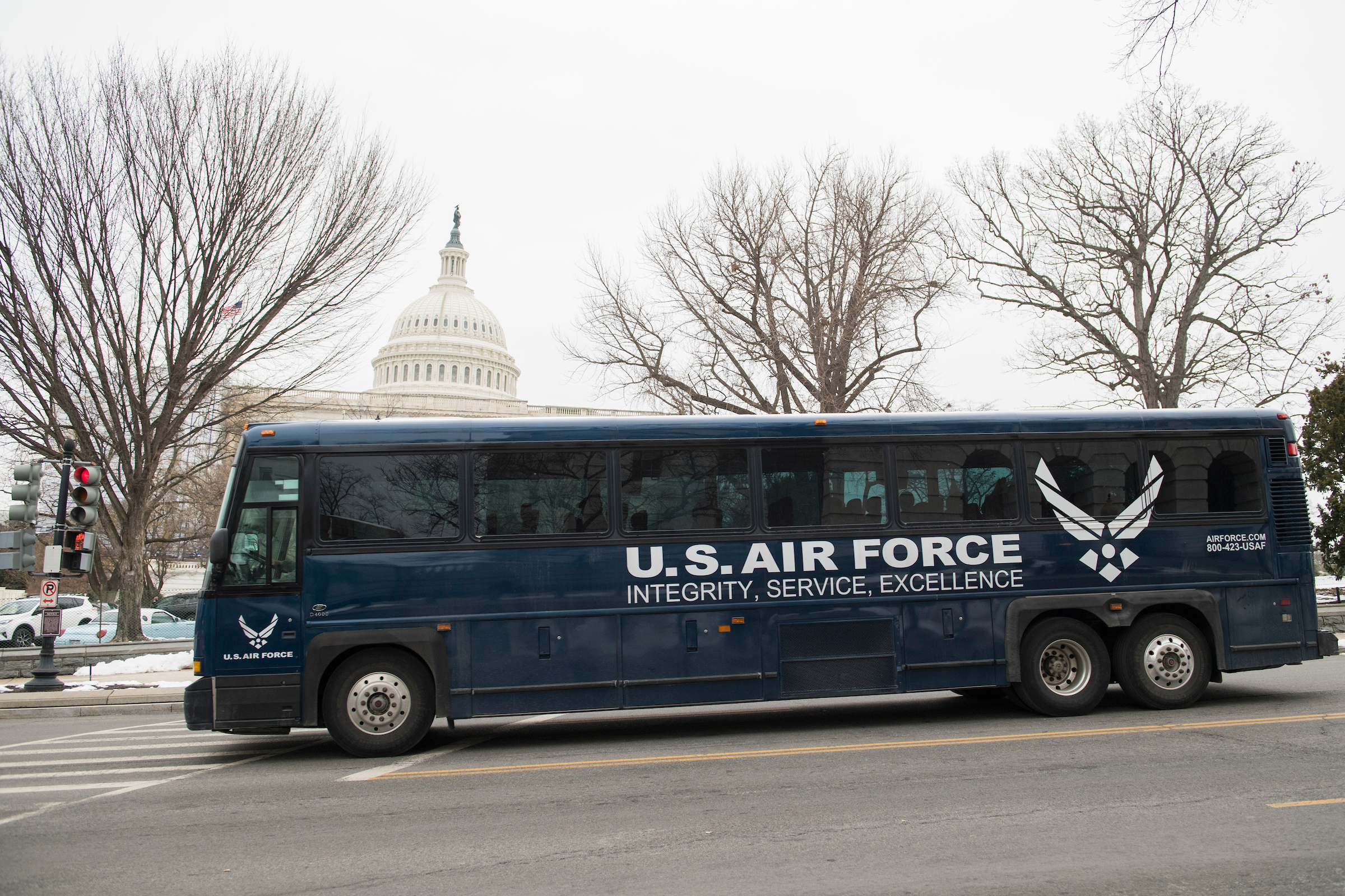 A bus is seen on Independence Avenue after dropping members off on Capitol Hill following the cancellation by President Trump on Thursday of an overseas CODEL. (Tom Williams/CQ Roll Call)