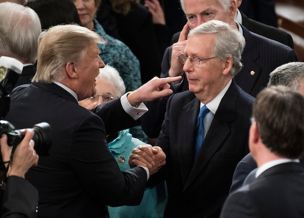 President Donald Trump shakes hands with Senate Majority Leader Mitch McConnell  after delivering his address to a joint session of Congress in 2017. (Bill Clark/CQ Roll Call file photo)