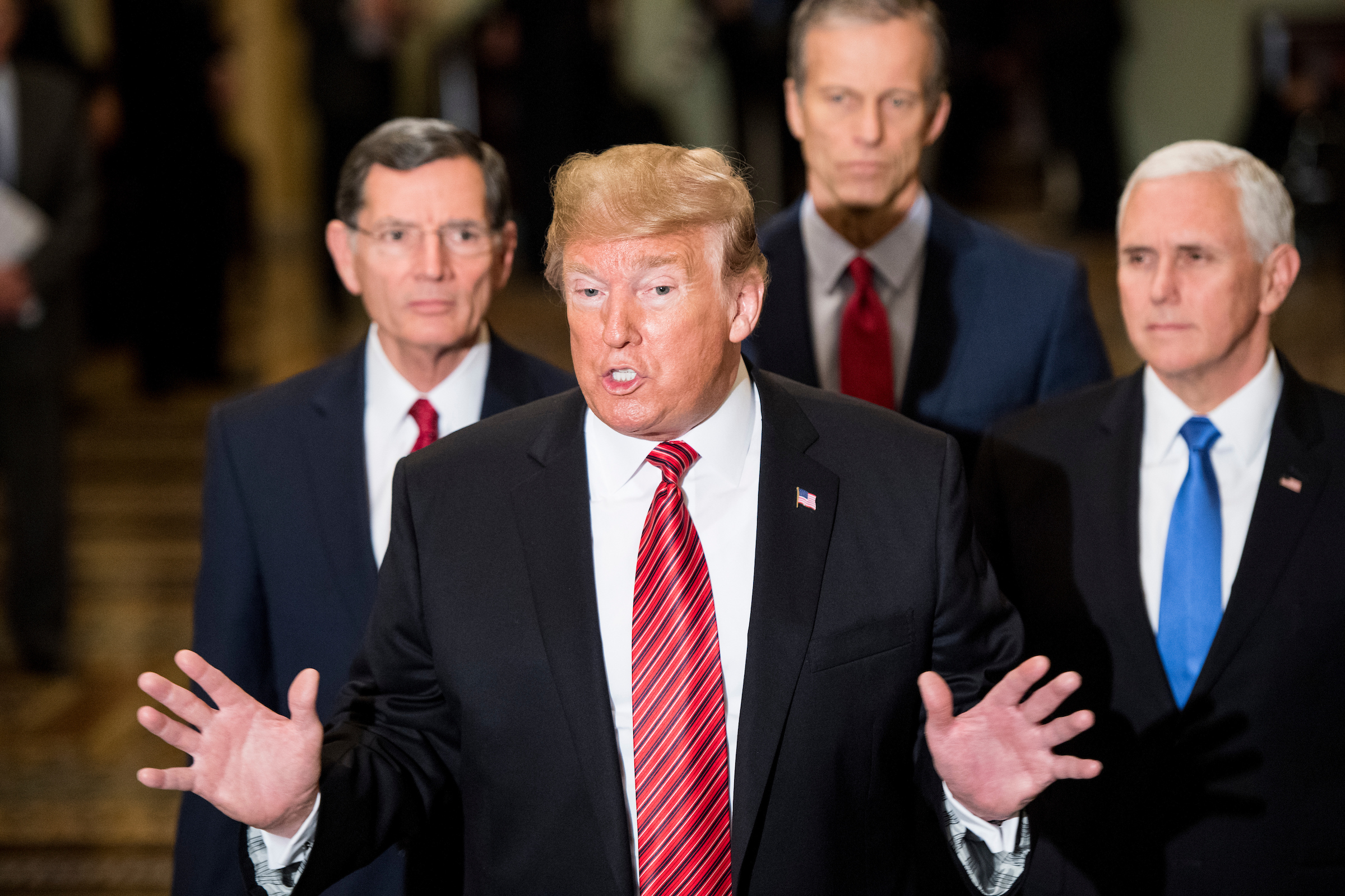 President Donald Trump — here in January 2018 with Sens. John Barrasso of Wyoming and John Thune of South Dakota and Vice President Mike Pence — has clear legislative goals despite confusion at times on the Hill as to what they are, legislative affairs director Eric Ueland says. (Bill Clark/CQ Roll Call file photo)