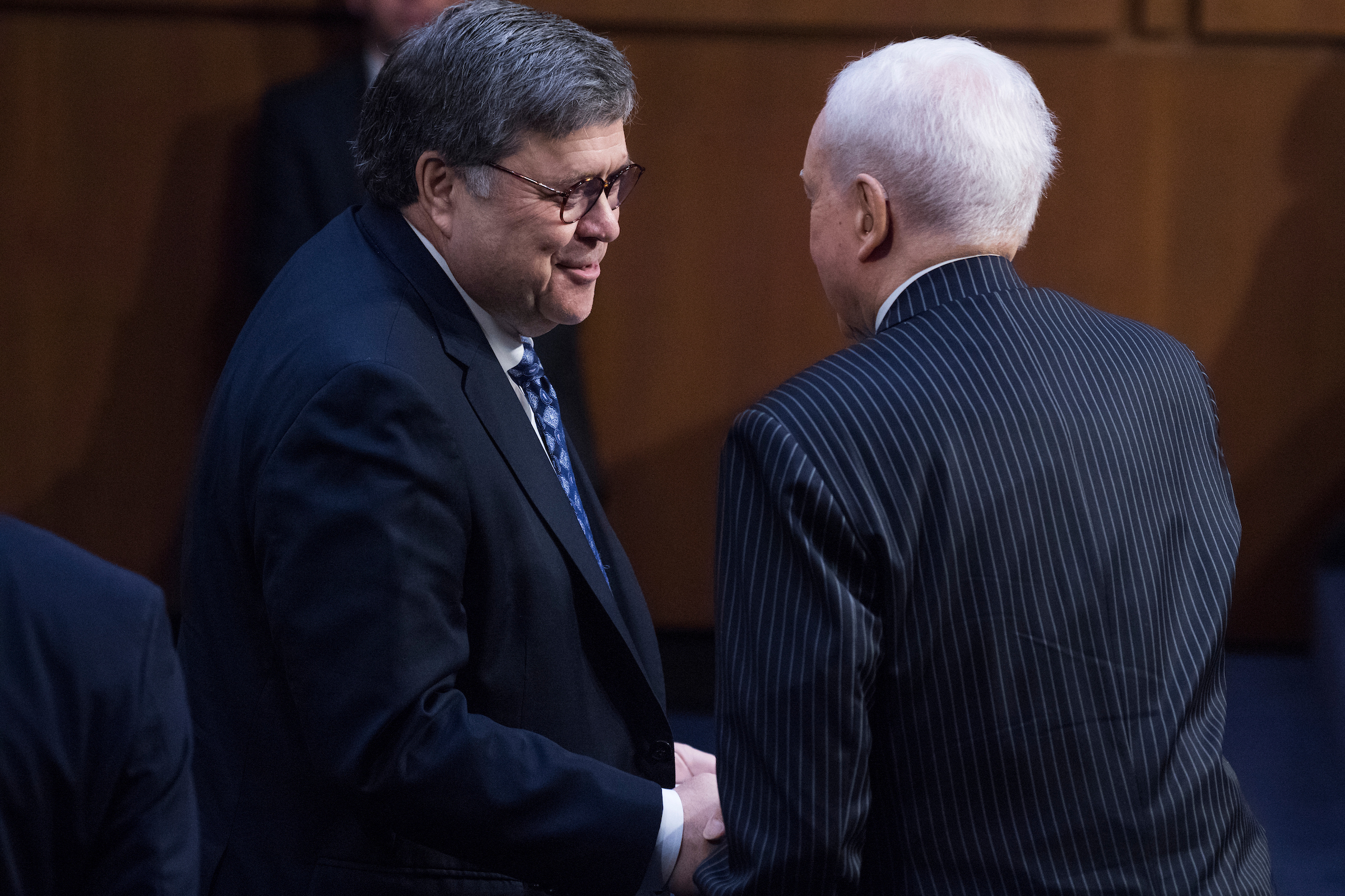 William P. Barr, left, nominee for attorney general, greets former Sen. Orrin Hatch, R-Utah, upon arriving for his Senate Judiciary Committee confirmation hearing in Hart Building on Tuesday, January 15, 2019. Hatch introduced Barr to the committee. (Tom Williams/CQ Roll Call)