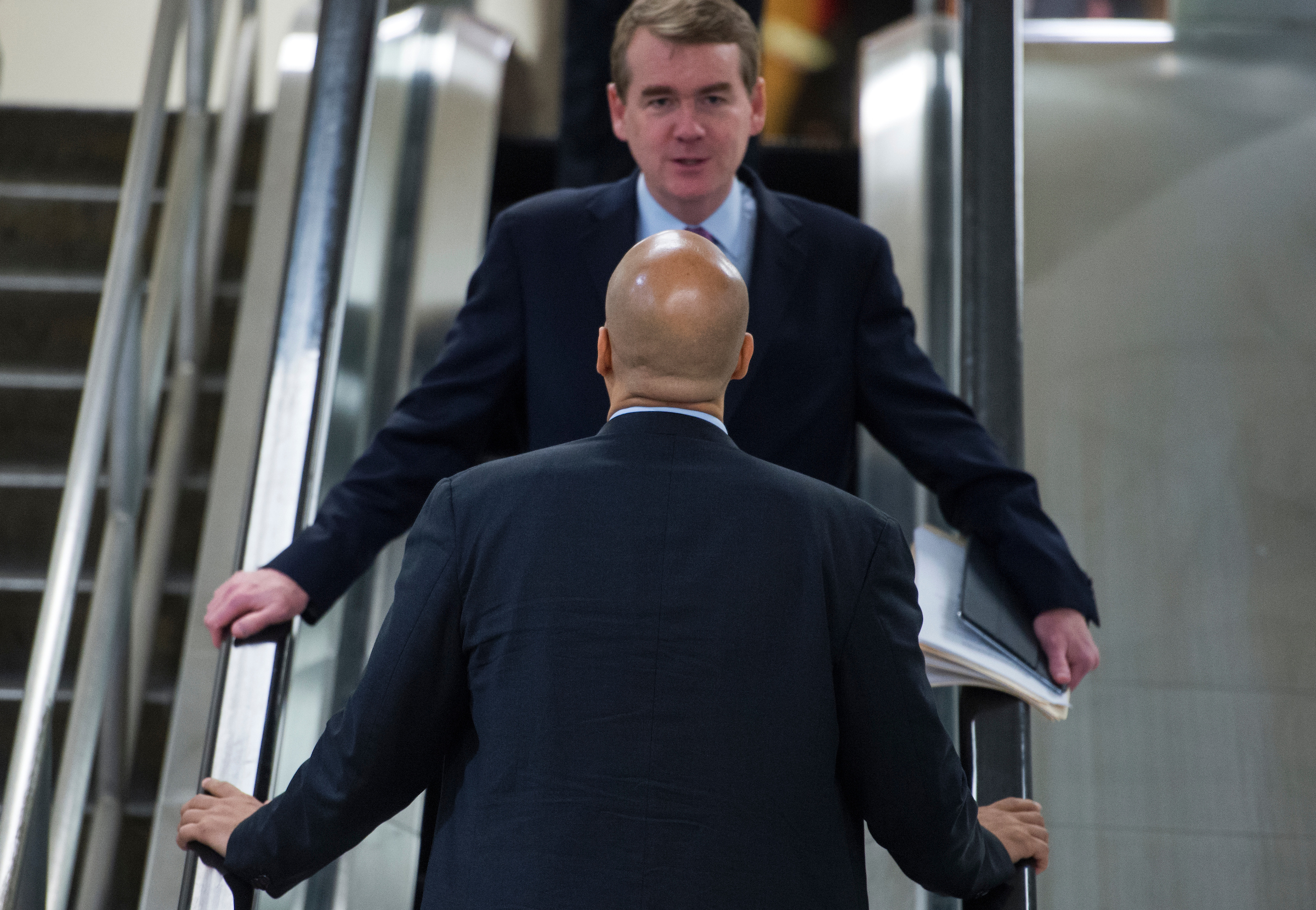 Bennet would join an already crowded Democratic field, including New Jersey Sen. Cory Booker, seen here with the Colorado senator in the Senate basement in 2017. (Tom Williams/CQ Roll Call file photo)