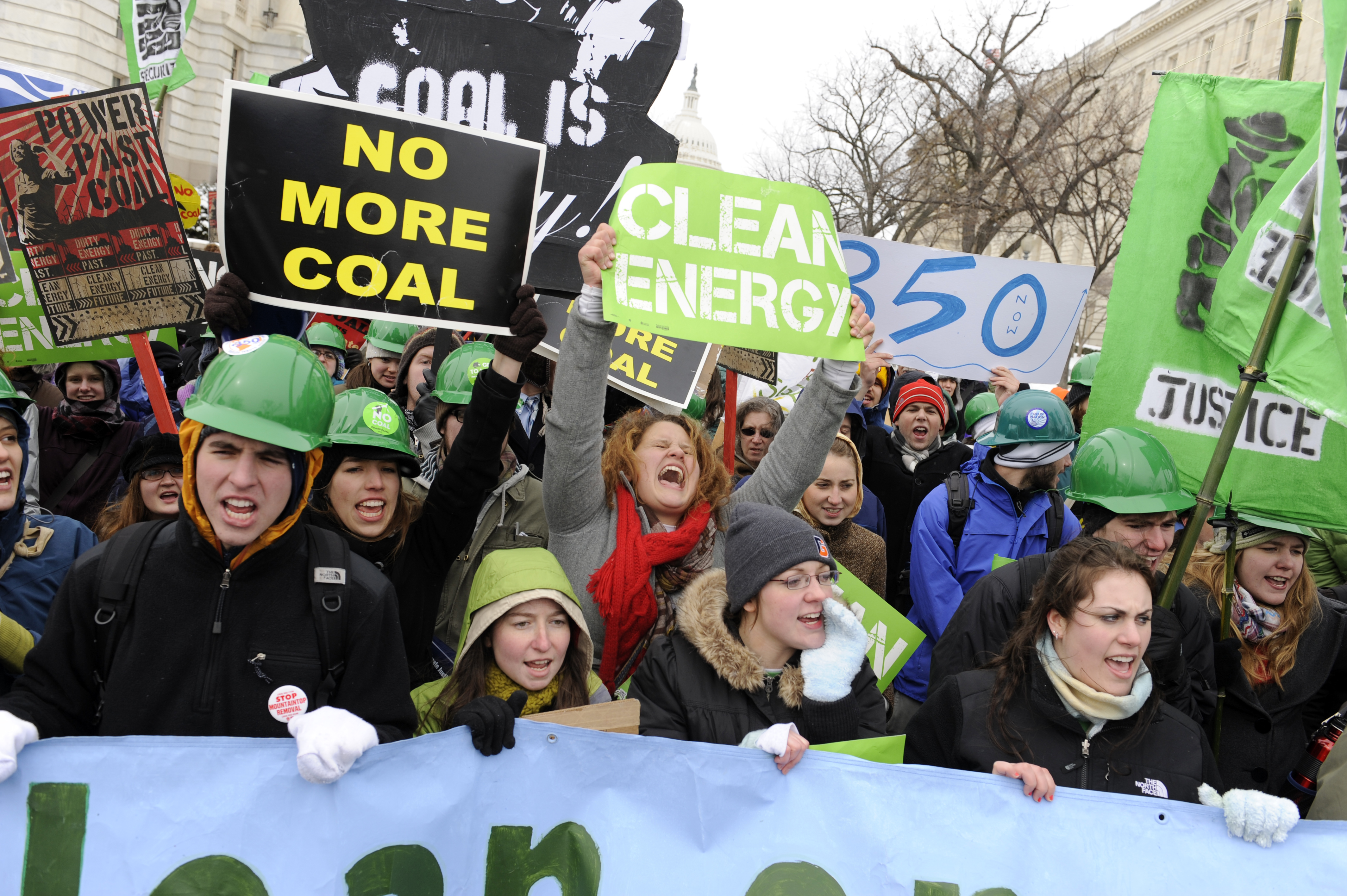 Clean energy advocates demonstrate in Washington, D.C., in March 2009. Progressive proposals featured in various expressions of the Green New Deal are likely to drive deeper partisan divisions and diminish the chances for real action, Grumet writes. (Tom Williams/CQ Roll Call file photo)