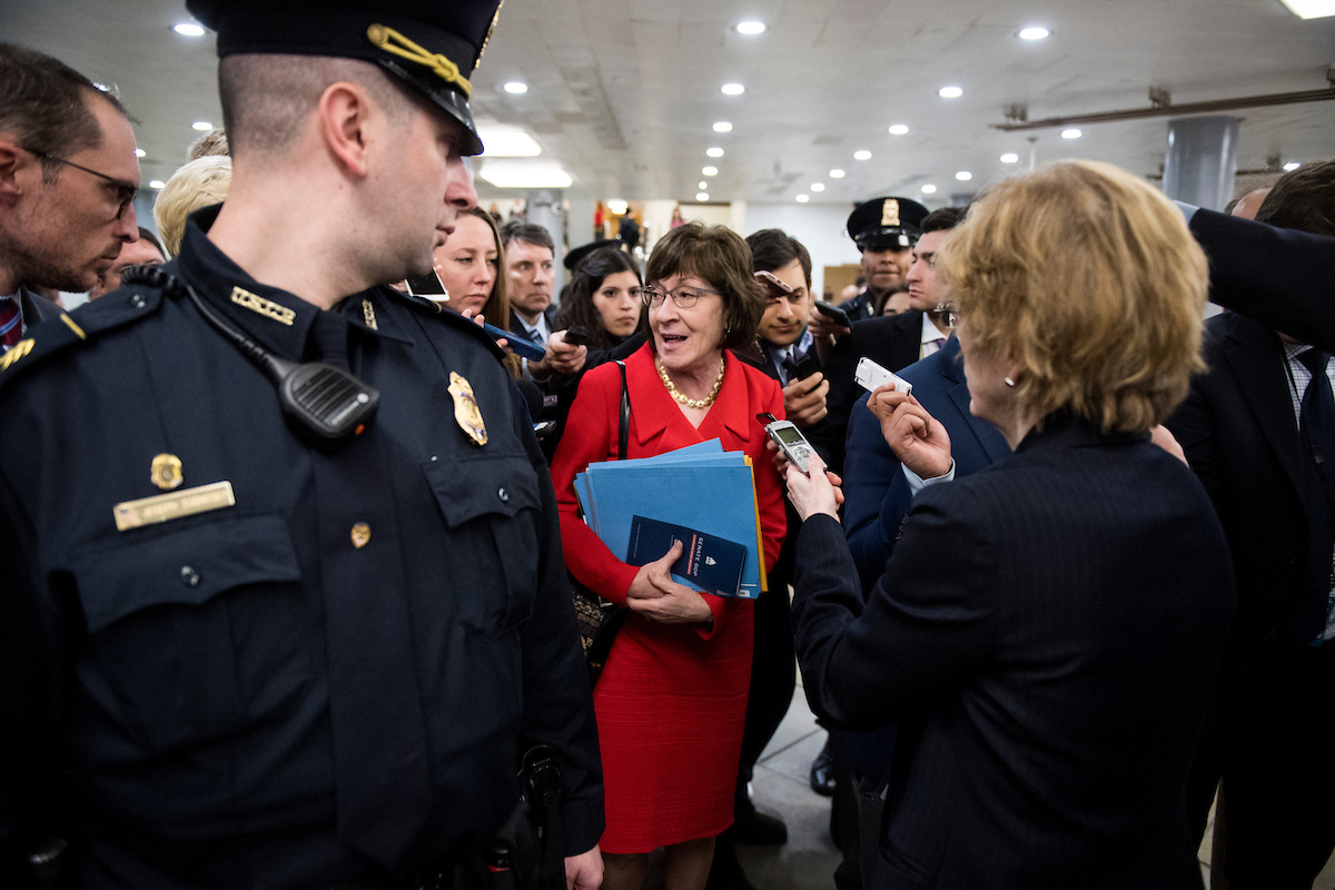Multiple Capitol Police officers flanked Sen. Susan Collins, R-Me., Thursday. (Bill Clark/CQ Roll Call)