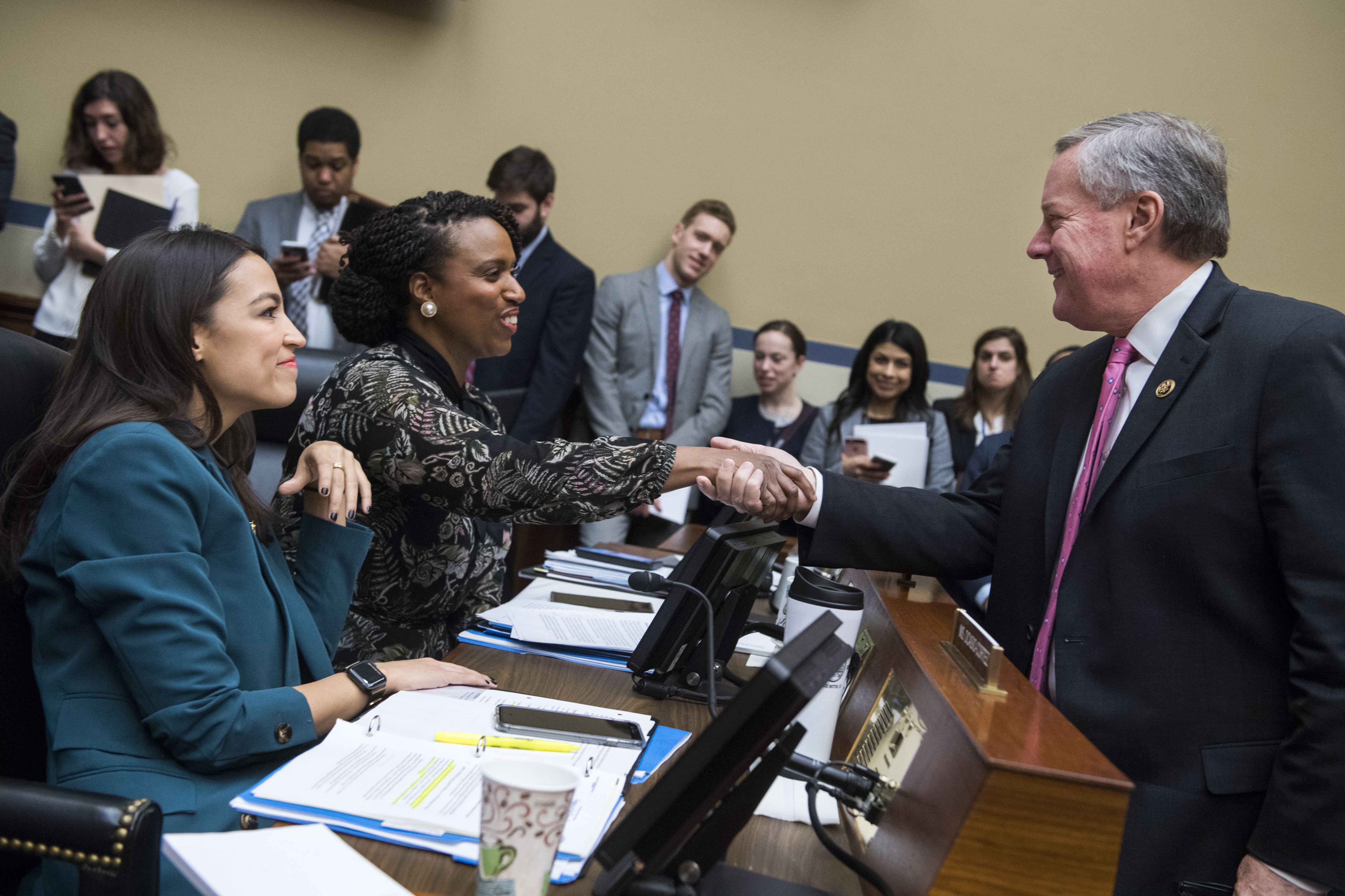 UNITED STATES - JANUARY 29: From left, Reps. Alexandria Ocasio-Cortez, D-N.Y., Ayanna Pressley, D-Mass., and Mark Meadows, R-N.C., talk during a House Oversight and Reform Committee business meeting in Rayburn Building on Tuesday, January 29, 2019. (Photo By Tom Williams/CQ Roll Call)