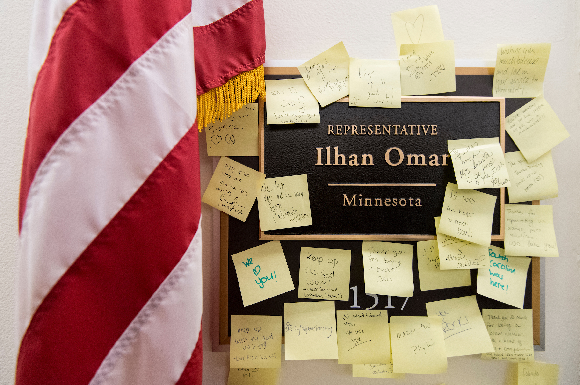 Post-It Notes with words of support are posted on the nameplate for Rep. Ilhan Omar, D-Minn., outside her office in the Longworth House Office Building on Monday, Feb. 11, 2019. (Bill Clark/CQ Roll Call)