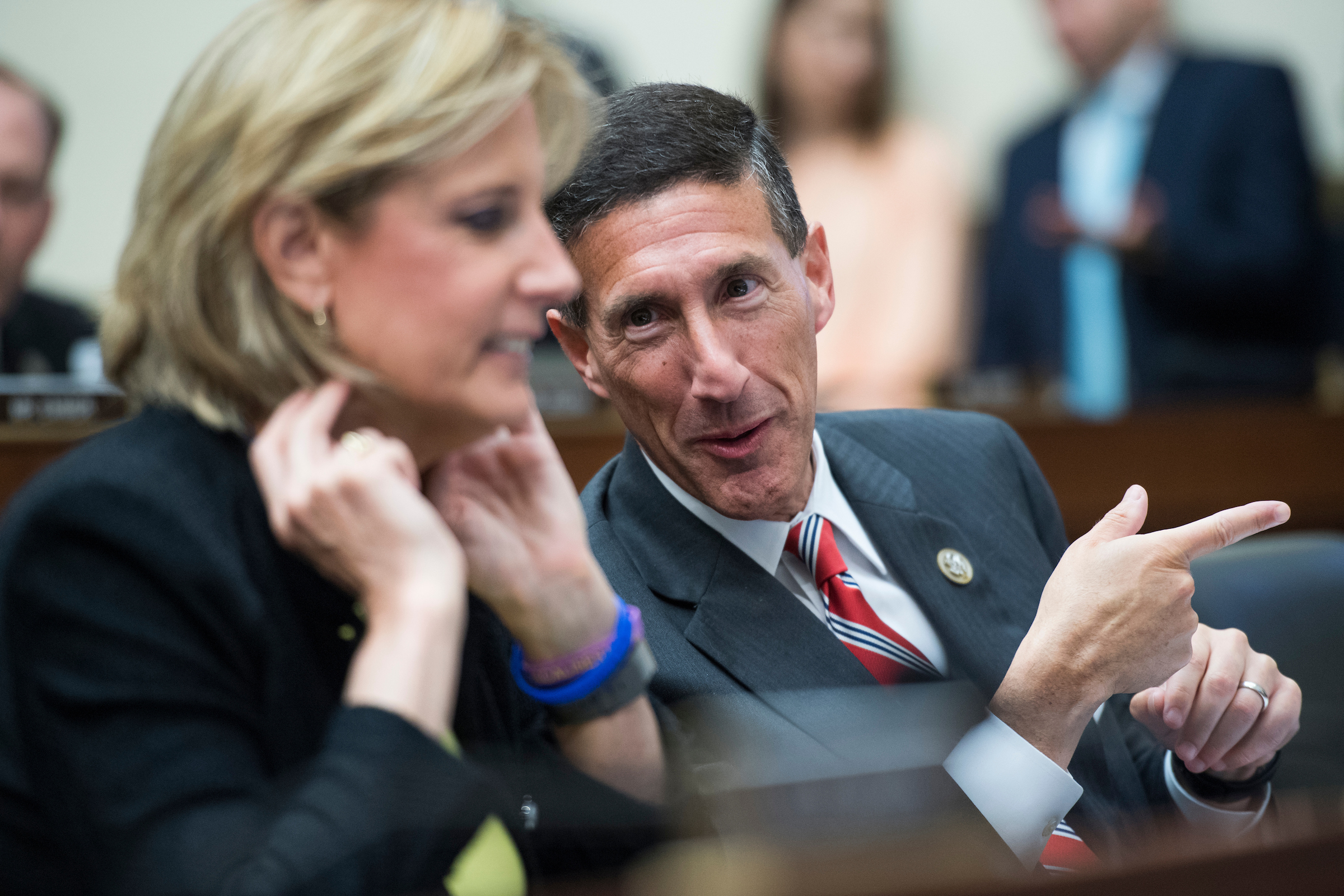 Reps. David Kustoff, R-Tenn., and Claudia Tenney, R-N.Y., talk before a House Financial Services Committee hearing in Rayburn Building titled “Oversight of the U.S. Securities and Exchange Commission” on June 21, 2018. (Tom Williams/CQ Roll Call file photo)