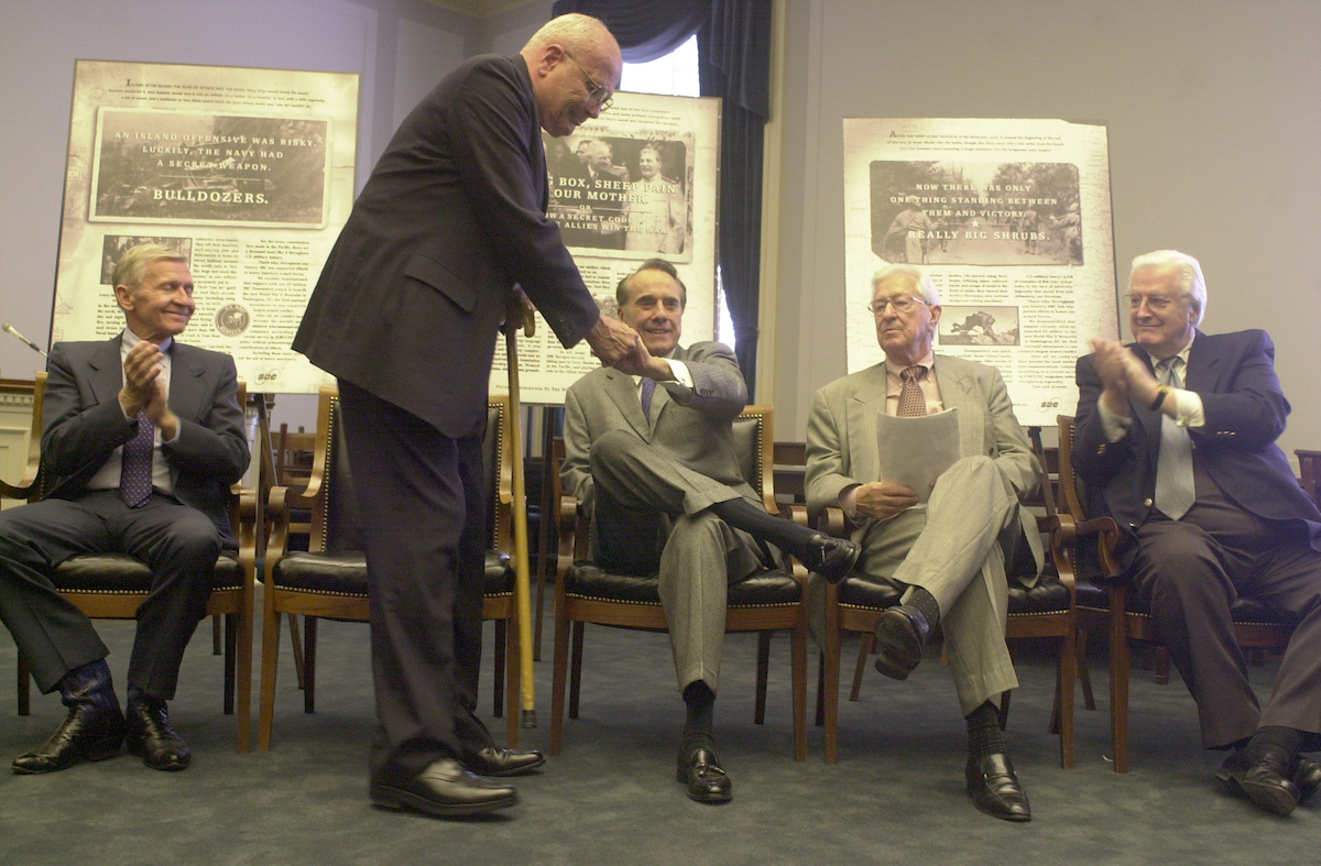 WWII mem.1(TW)052400 -- Rep. John Dingell was greeted to his seat after speaking by fellow WWII vets Reps. Henry Hyde, Ralph Hall, Sen. Bob Dole and Rep. Bob Stump. The group was honored by SBC Communications Inc. who contributed $3 million to the National World War II Memorial.