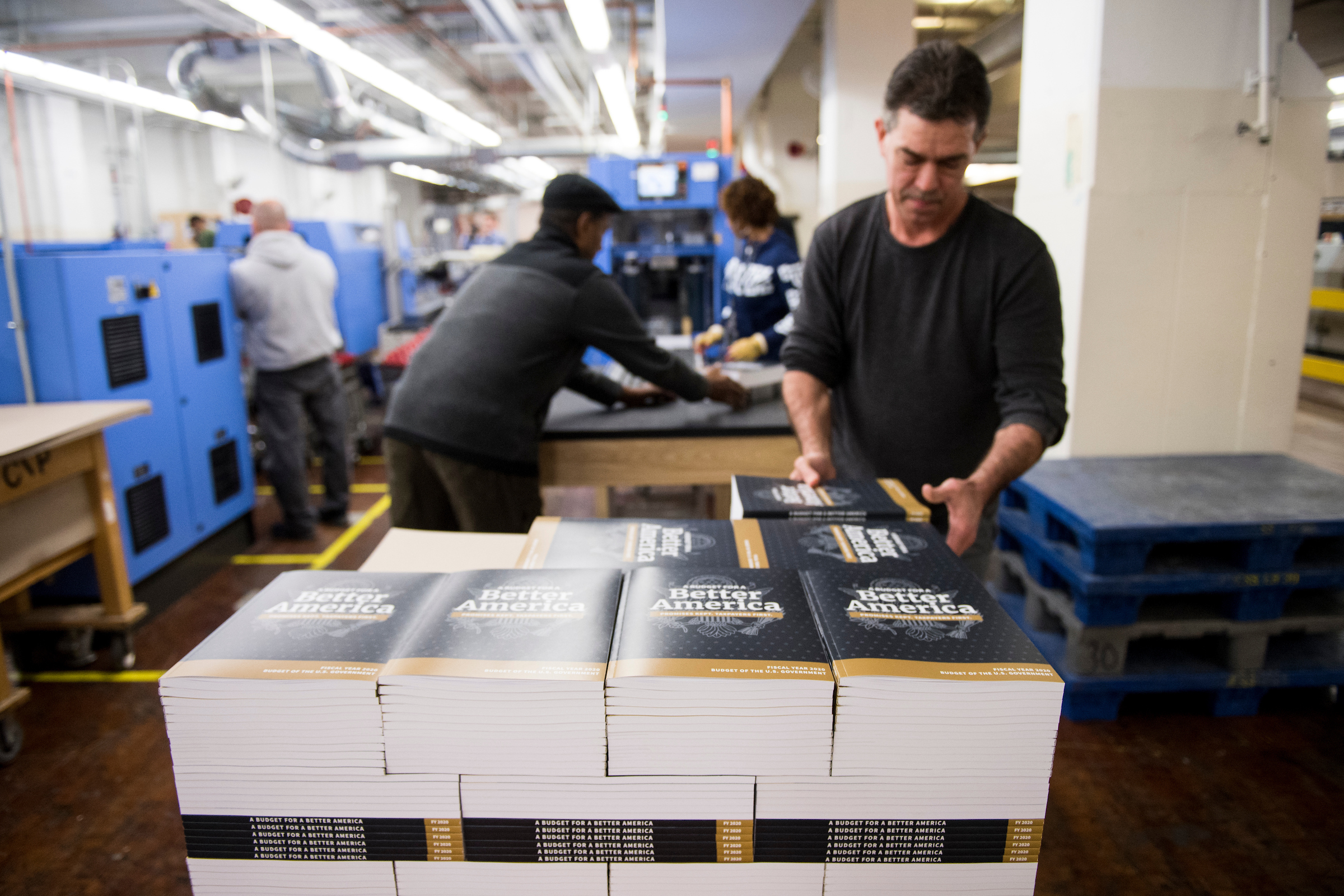 Copies of President Donald Trump’s budget for Fiscal Year 2020 are prepared for distribution at the Government Publishing Office in Washington on March 7. (Bill Clark/CQ Roll Call)