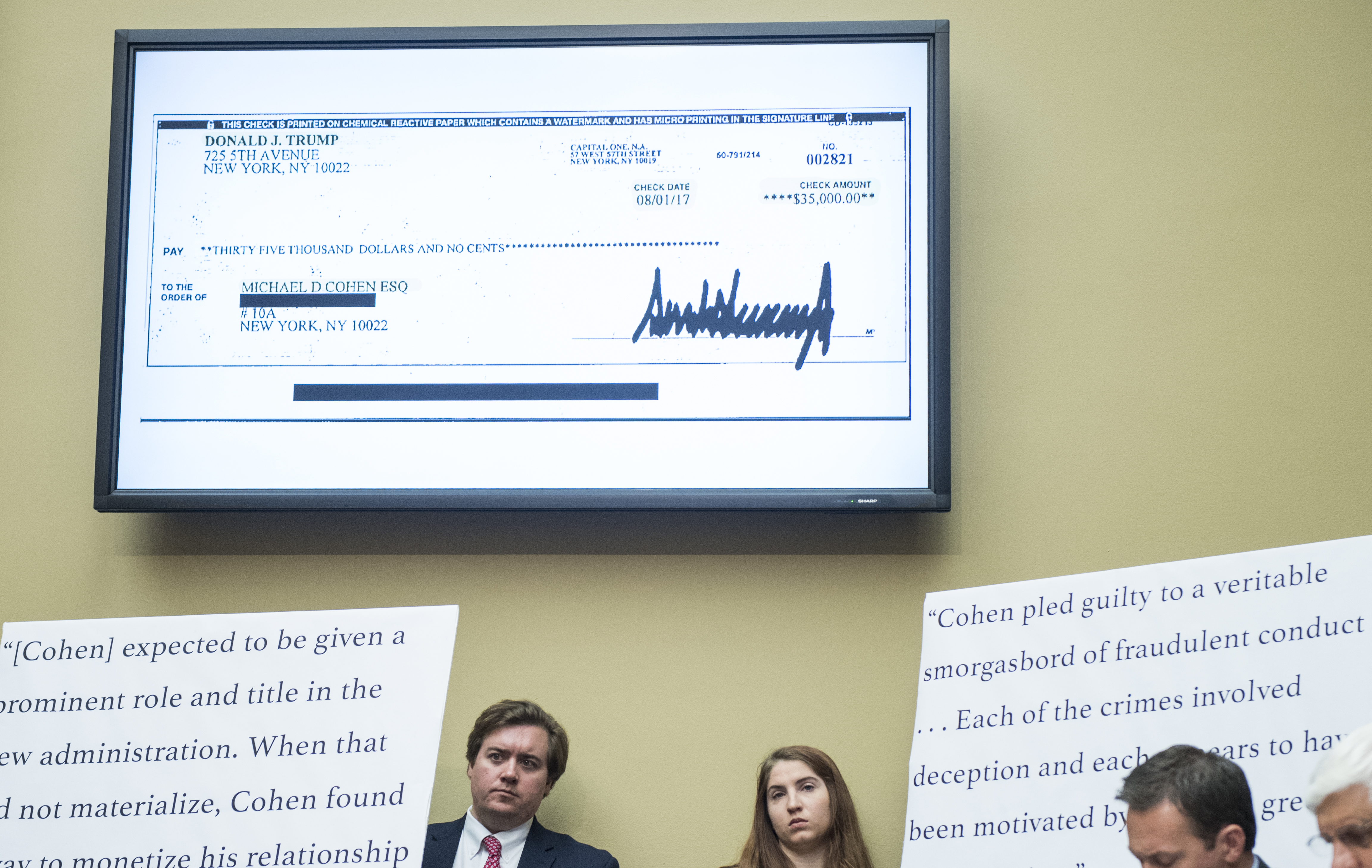 UNITED STATES - FEBRUARY 27: A check payable from President Donald Trump to Michael Cohen, former attorney for President Donald Trump, is displayed in the hearing room as Cohen testifyies during the House Oversight and Reform Committee hearing on Russian interference in the 2016 election on Wednesday, Feb. 27, 2019. (Photo By Bill Clark/CQ Roll Call)