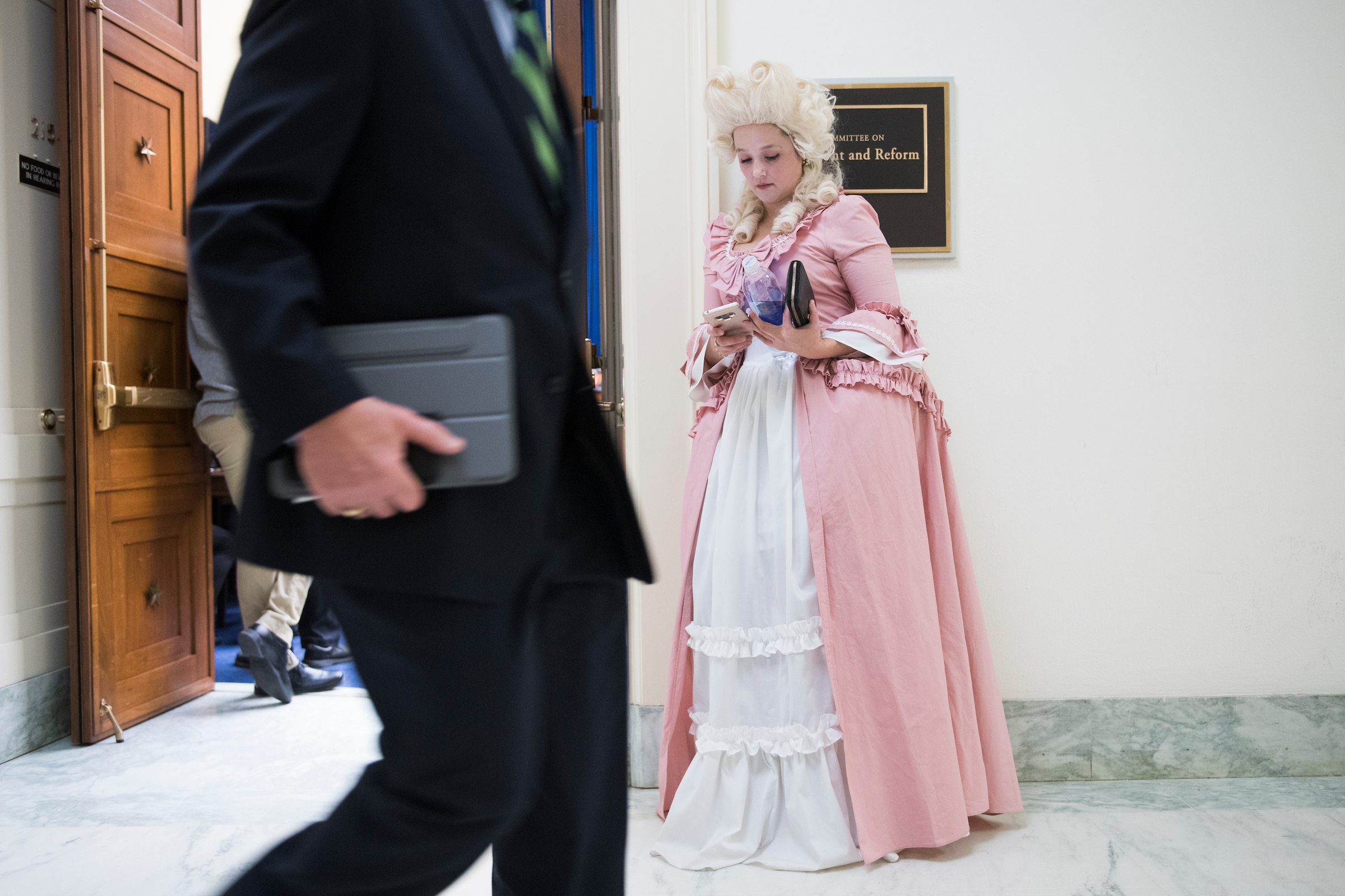 UNITED STATES - MARCH 14: Lauren Windsor of American Family Voices, dressed as Marie Antoinette, is seen outside a House Oversight and Reform Committee hearing in Rayburn Building where Commerce Secretary Wilbur Ross testified on preparations for the 2020 Census and citizenship questions on Thursday March 14, 2019. She dressed as Antoinette to highlight Ross's wealth. (Photo By Tom Williams/CQ Roll Call)