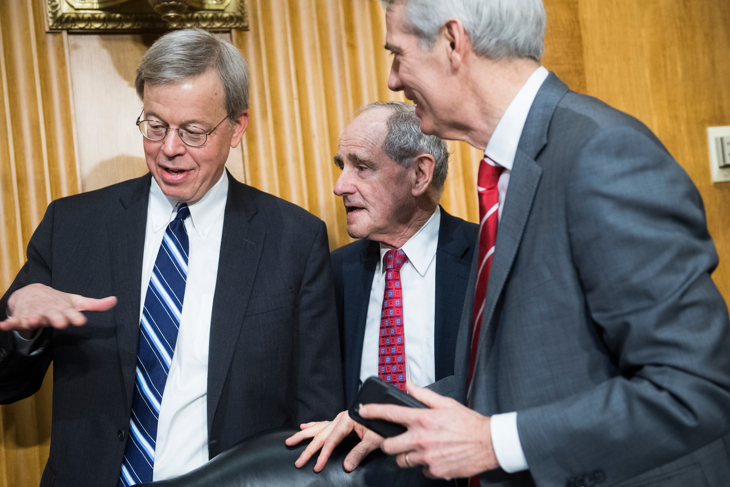 From left, Jim Talent, commissioner of the U.S.-China Economic and Security Review Commission, Chairman James Risch, R-Idaho, and Sen. Rob Portman, R-Ohio, arrive for a Senate Foreign Relations Committee in Dirksen Building titled 