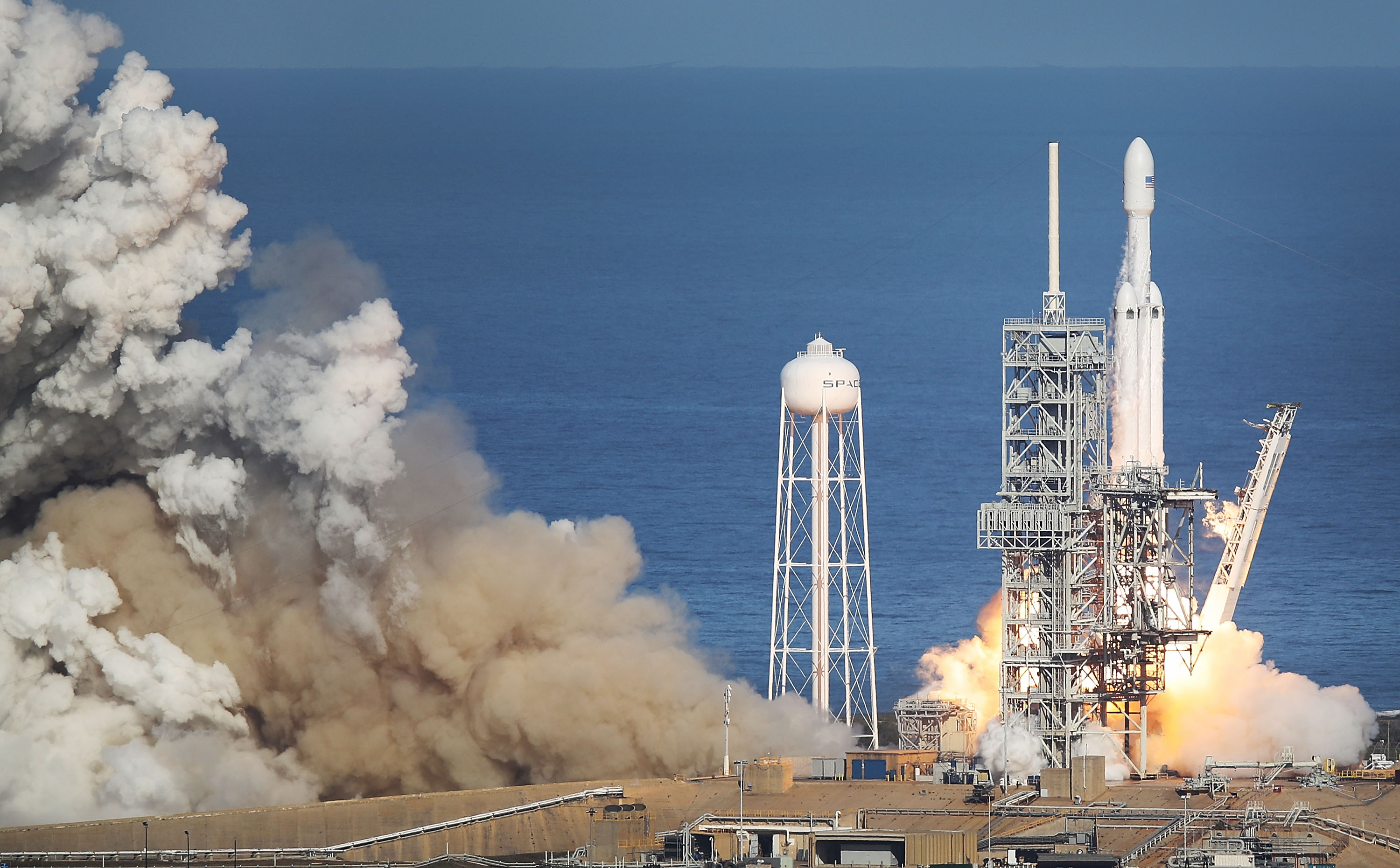 The SpaceX Falcon Heavy rocket lifts off from launch pad 39A at Kennedy Space Center on February 6, 2018 in Cape Canaveral, Florida. The rocket is the most powerful rocket in the world and is carrying a Tesla Roadster into orbit. (Joe Raedle/Getty Images)