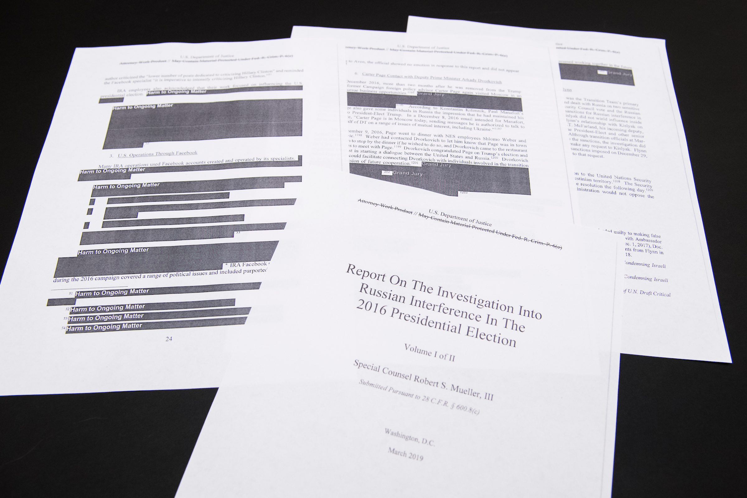 Media films a few pages of special counsel Robert Mueller's report on Russian interference in the 2016 election which was printed out by staff in the House Judiciary Committee's hearing room on Thursday, April 18, 2019. (Tom Williams/CQ Roll Call)