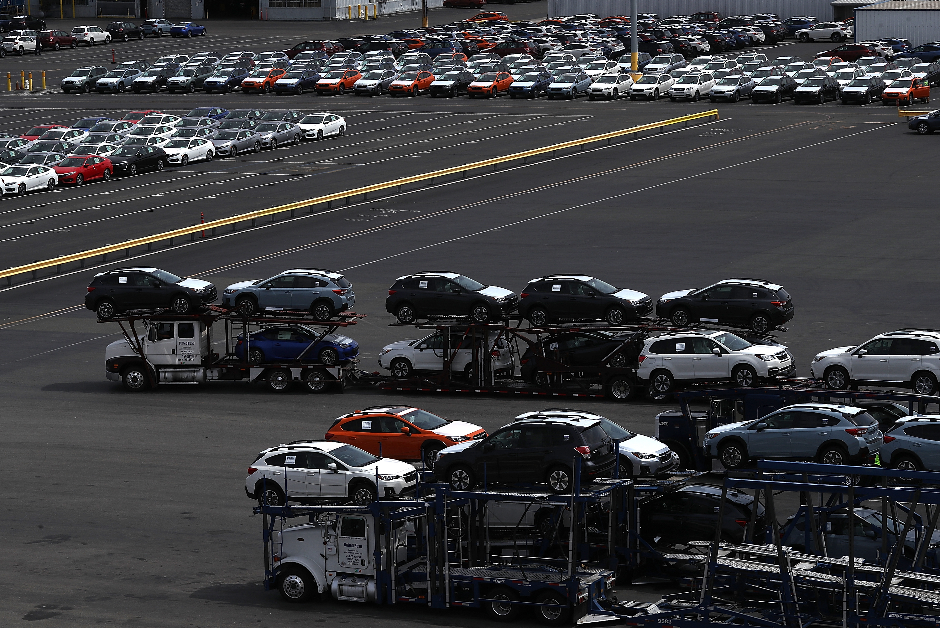 Brand new cars sit on a truck that is leaving a lot at the Auto Warehousing Company near the Port of Richmond on May 24, 2018 in Richmond, California. U.S. president Donald Trump has set a clock on possible trade action or tariffs against car imports from Japan and Europe. (Justin Sullivan/Getty Images)