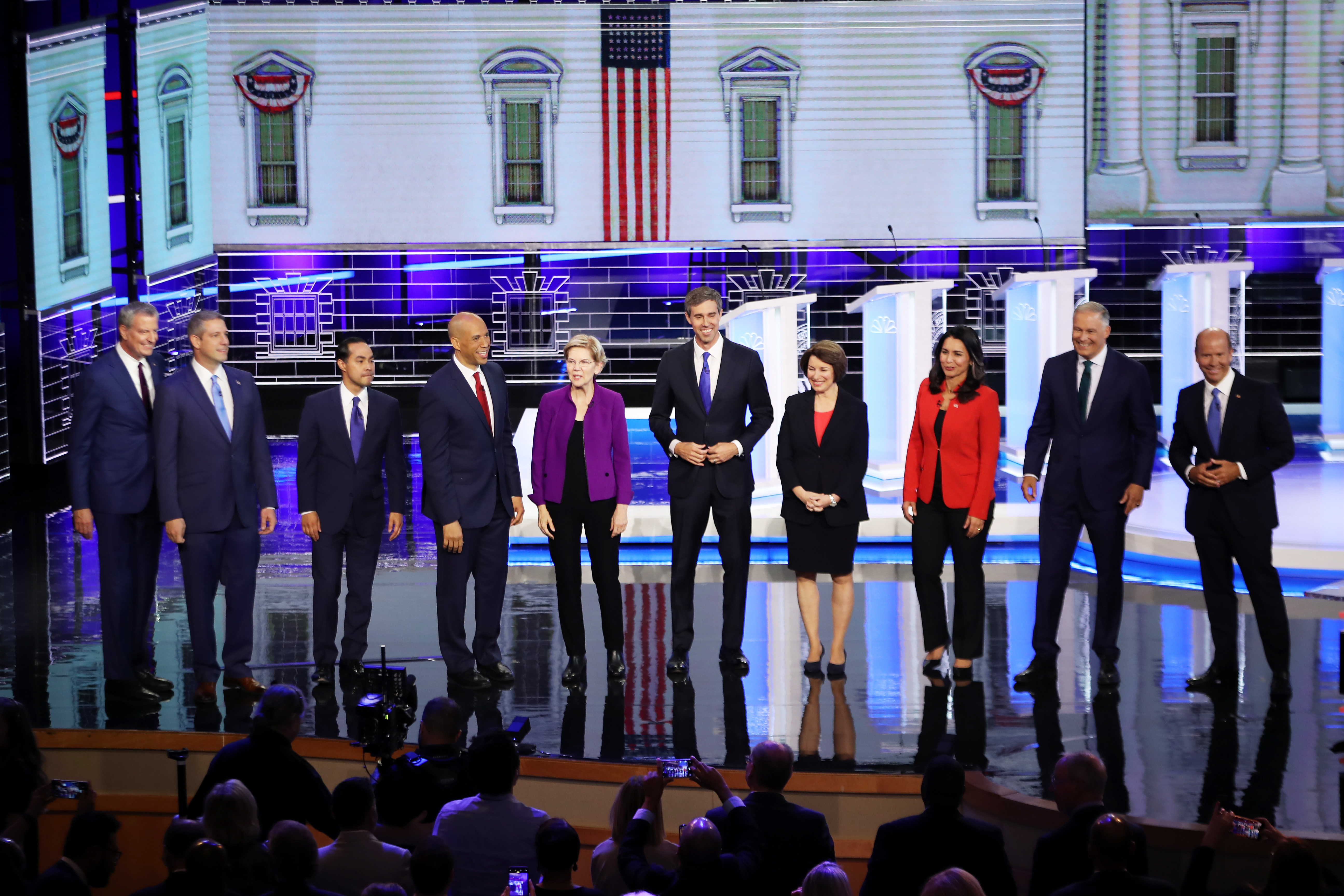 Democratic presidential candidates, from left, New York Mayor Bill de Blasio, Rep. Tim Ryan of Ohio, former housing secretary Julian Castro, Sen. Cory Booker of New Jersey, Sen. Elizabeth Warren of Massachusetts, former Rep. Beto O'Rourke of Texas, Sen. Amy Klobuchar of Minnesota, Rep. Tulsi Gabbard of Hawaii, Washington Gov. Jay Inslee, and former Maryland Rep. John Delaney take the stage during the first Democratic debate. (Joe Raedle/Getty Images)