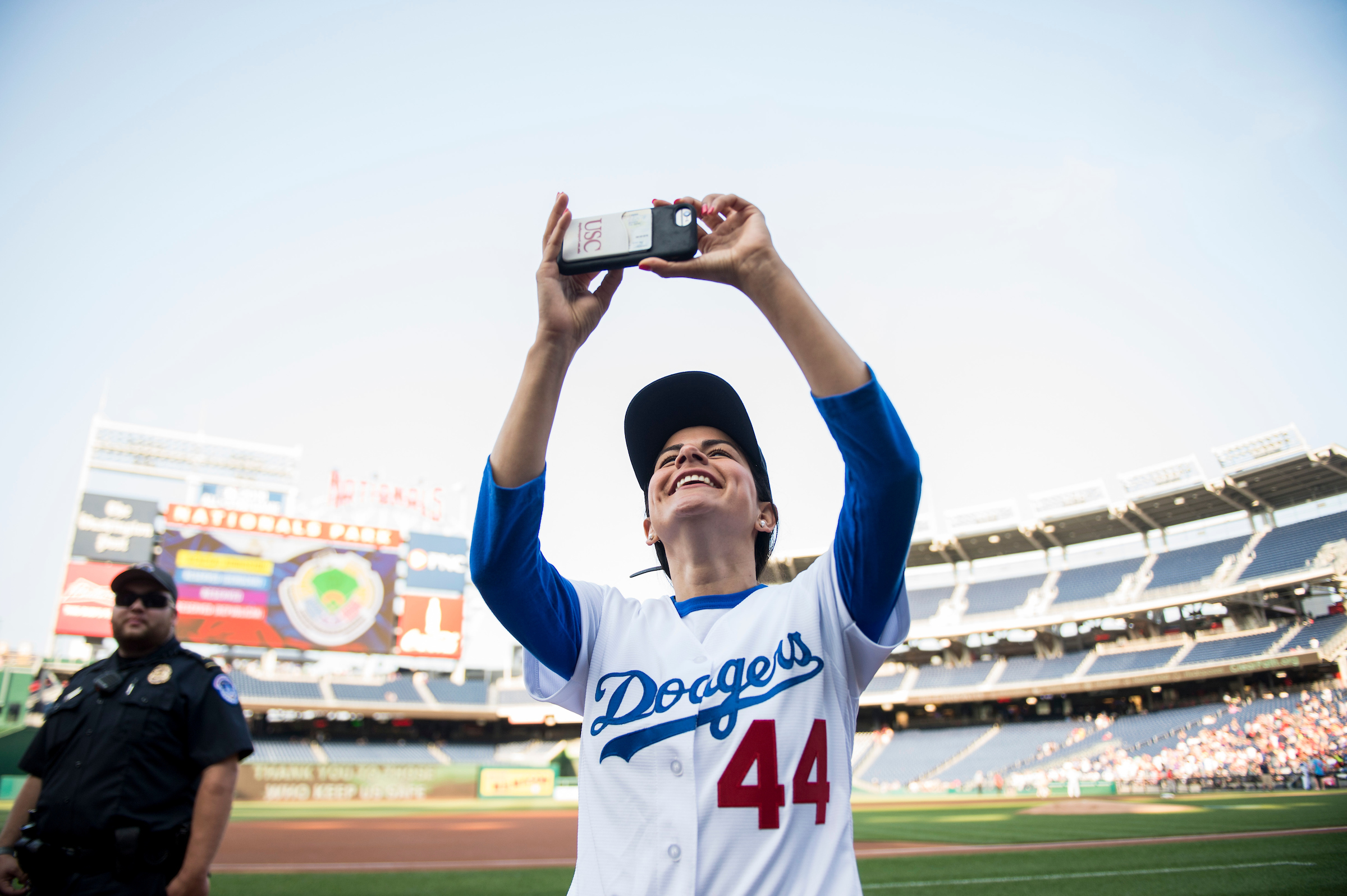 UNITED STATES - JUNE 15: Rep. Nanette Barragan, D-Calif., takes photos before the start of the annual Congressional Baseball Game at Nationals Park in Washington on Thursday, June 15, 2017. (Photo By Bill Clark/CQ Roll Call)