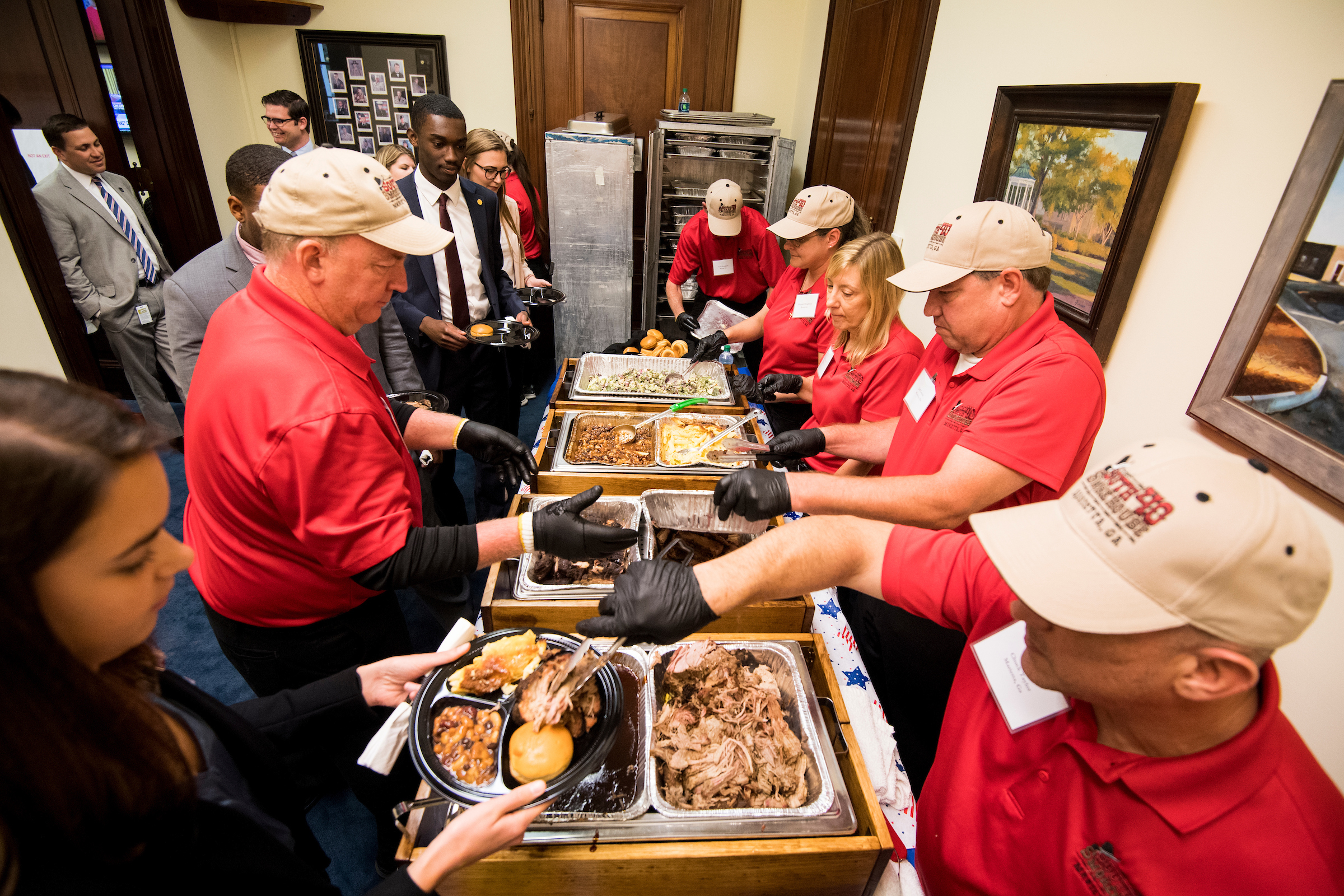 South 40 Smokehouse from Marietta, Ga., serves up brisket, pulled pork and ribs Thursday in the office of Sen. Johnny Isakson for his annual barbecue lunch. (Bill Clark/CQ Roll Call)