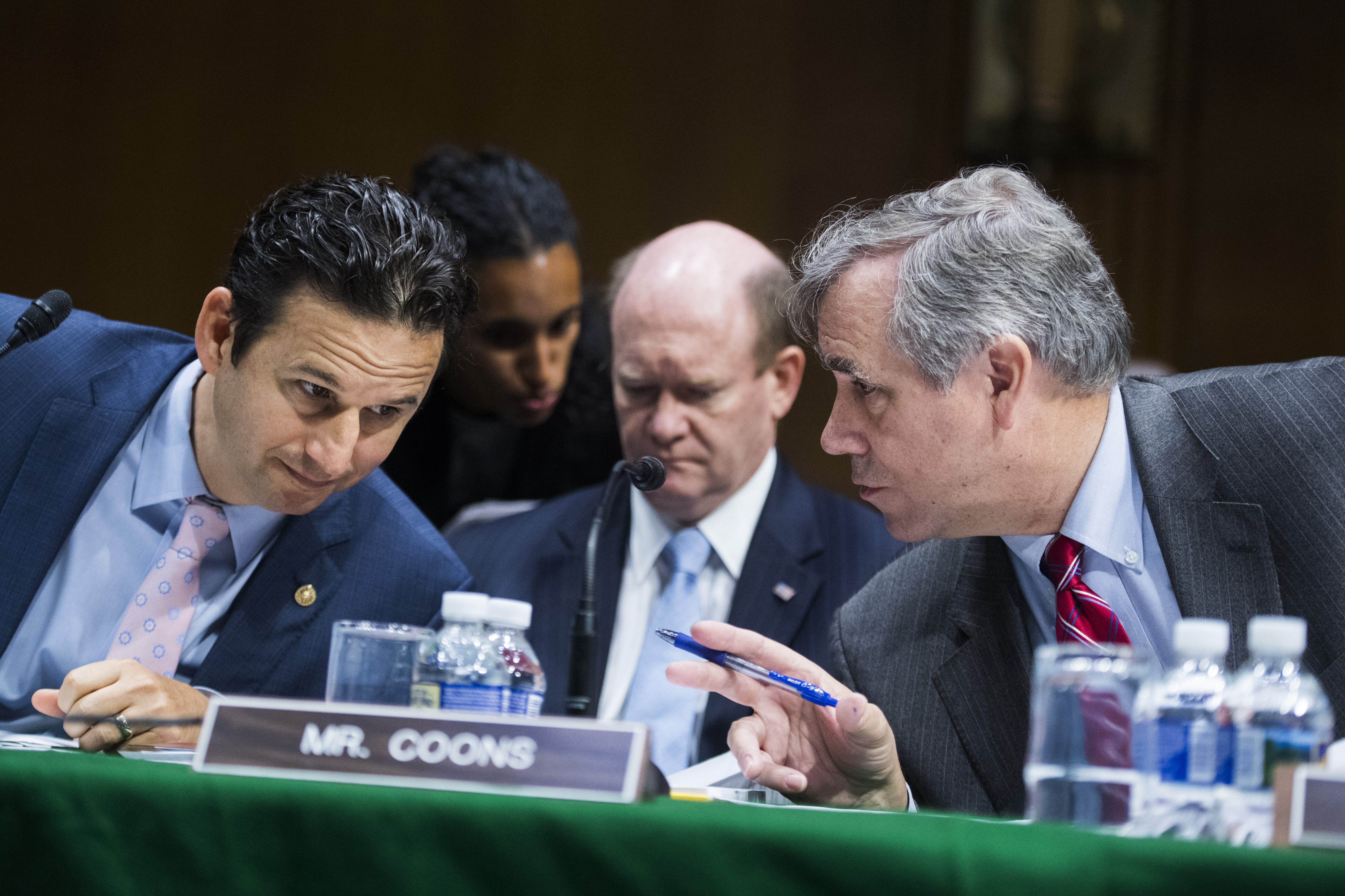 UNITED STATES - JUNE 19: From left, Sens. Brian Schatz, D-Hawaii, Chris Coons, D-Del., and Jeff Merkley, D-Ore., prepare for a Senate Appropriations Committee markup of the Emergency Supplemental Appropriations for Humanitarian Assistance and Security at the Southern Border Act, on Wednesday, June 19, 2019. (Photo By Tom Williams/CQ Roll Call)