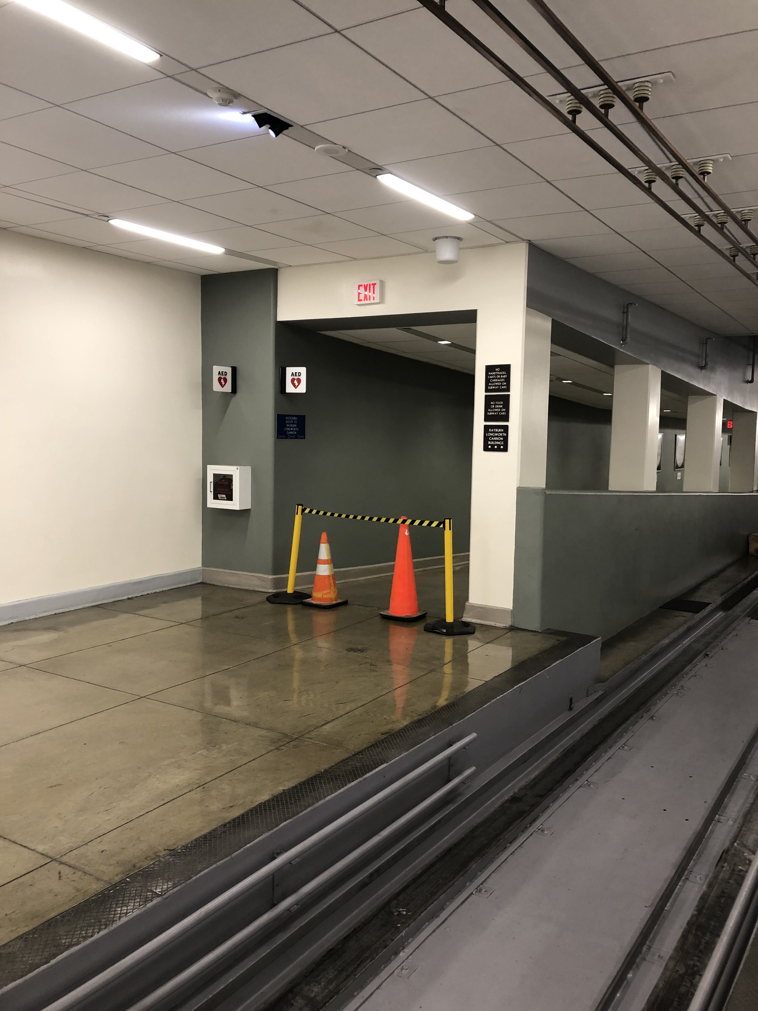 The pedestrian walkway in the Rayburn tunnel that connects to the Capitol flooded due to heavy rain Monday.