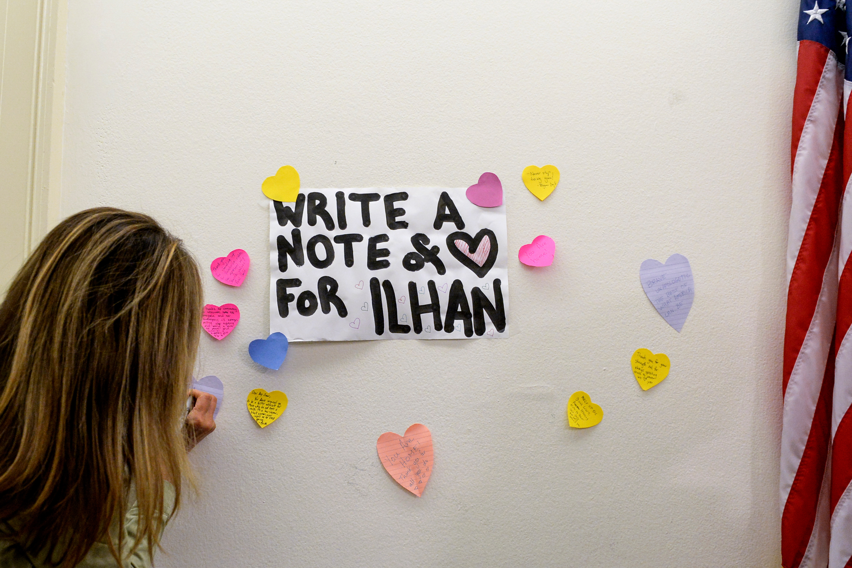 UNITED STATES - JULY 19: A visitor writes an inspiring notes outside of the office of Rep. Ilhan Omar, D-Minn., after attacks from President Trump days before at the Longworth Building at the Capitol on Friday July 19, 2019. (Photo by Caroline Brehman/CQ Roll Call)