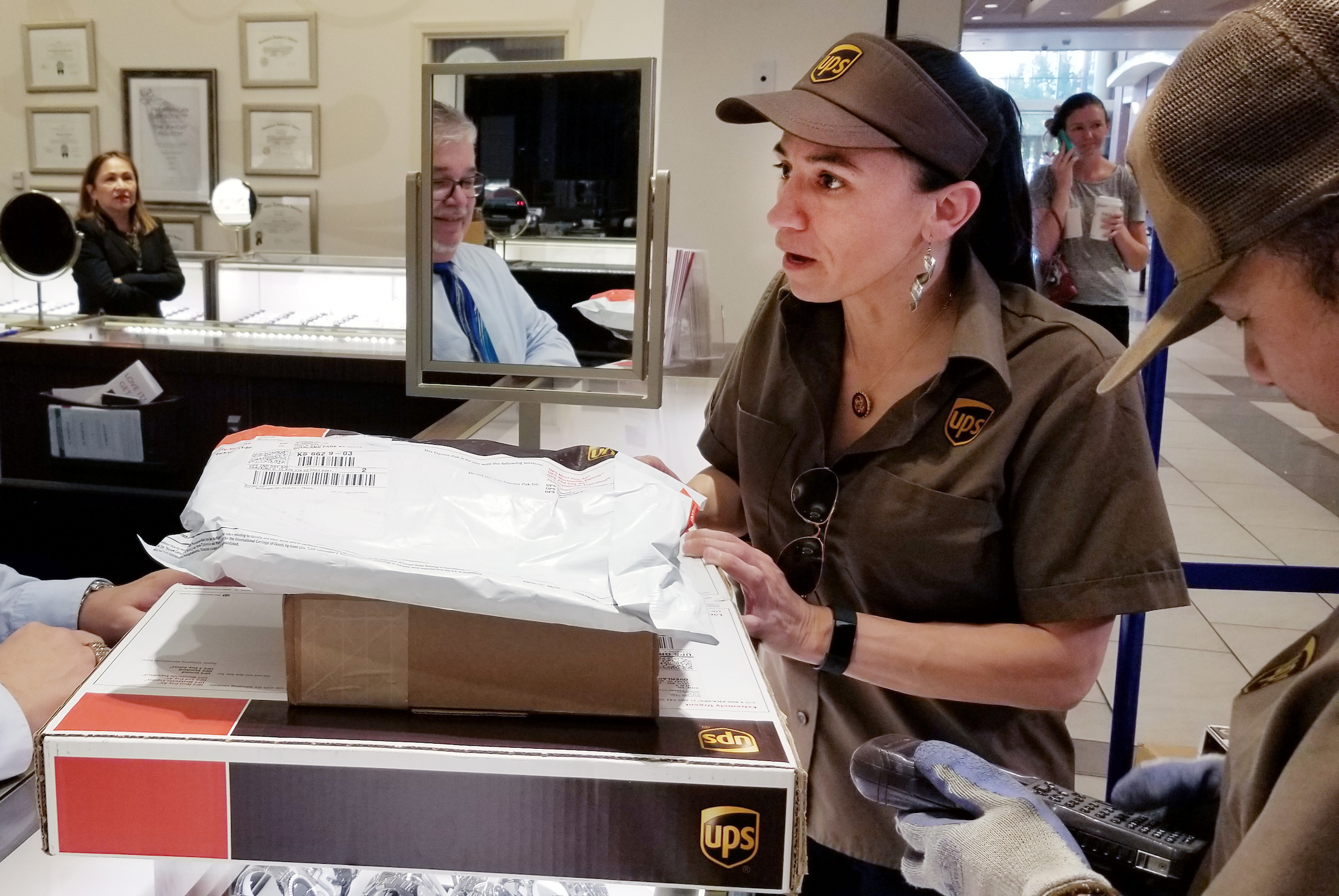 Kansas Rep. Sharice Davids delivers UPS packages on July 2 at the Oak Park Mall in Overland Park, Kan.,  as part of her “Sharice’s Shift” outreach program. (Stephanie Akin/CQ Roll Call file photo)