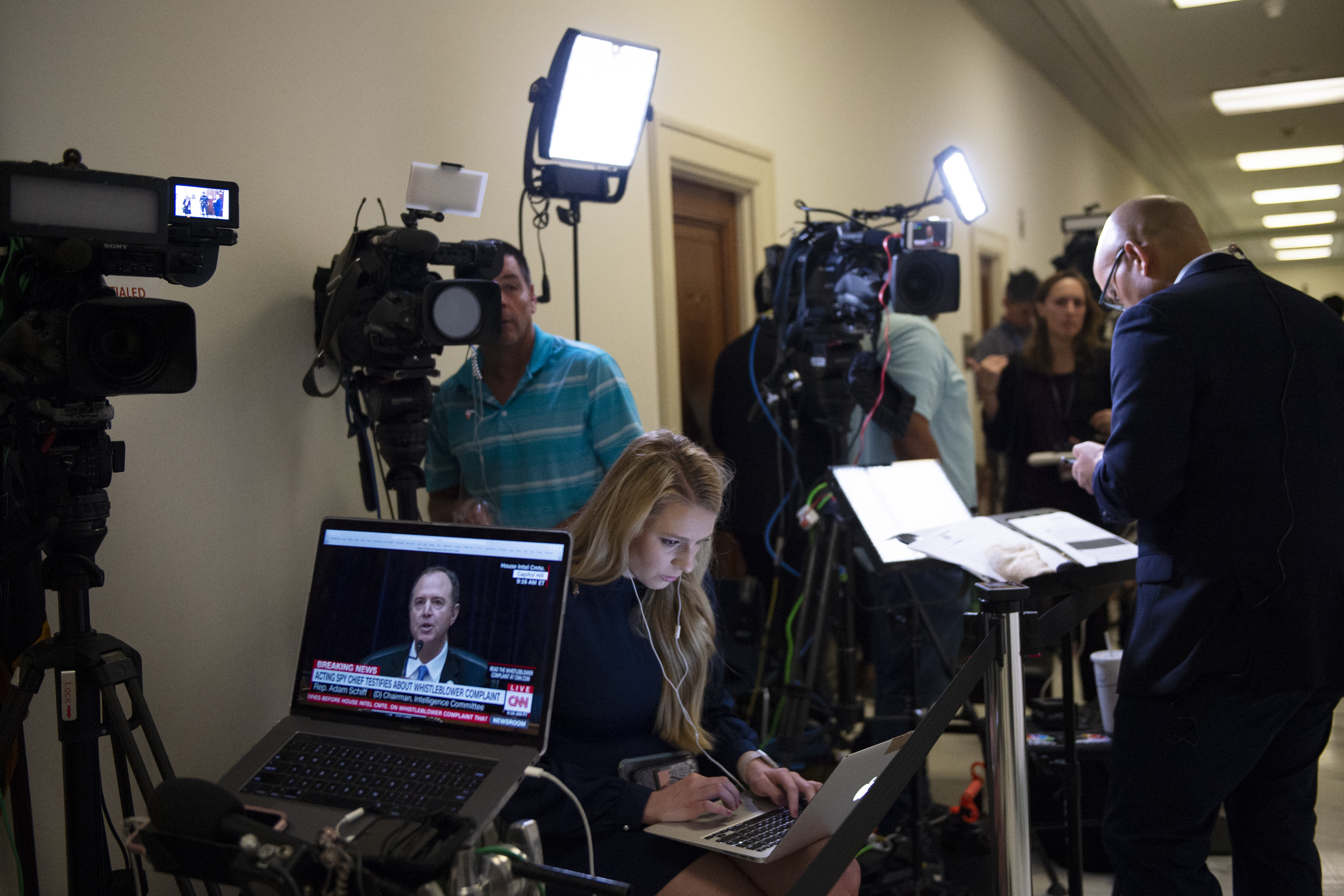 UNITED STATES - SEPTEMBER 26: The media gathers in the hallway outside of the House Intelligence Committee hearing room as Acting Director of National Intelligence Joseph Maguire testifies before the committee on the Capitol on Thursday, Sept. 26, 2019. (Photo by Caroline Brehman/CQ Roll Call)