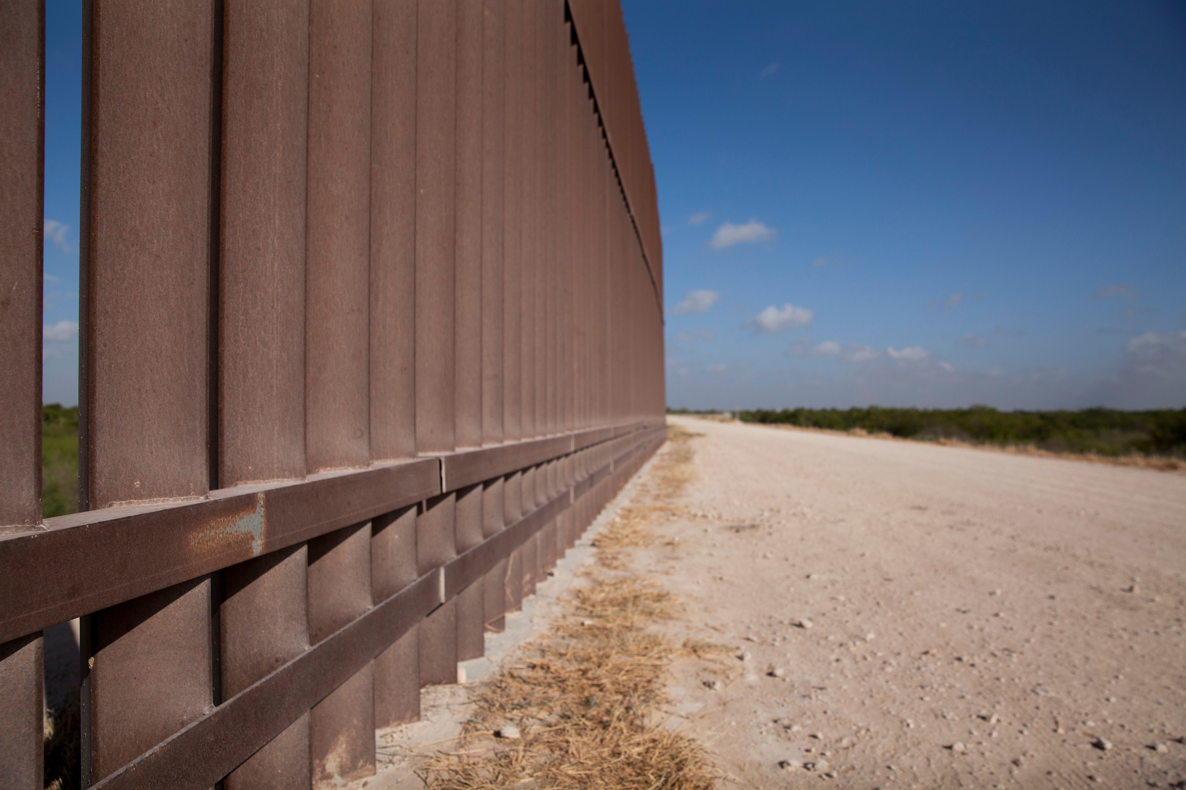 A section of border barrier stretches through the Rio Grande Valley sector of the Texas-Mexico border. (Jinitzail Hernández/CQ Roll Call)