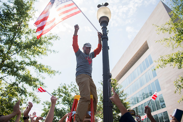 UNITED STATES - SEPTEMBER 16: Army veteran Bernie Siler, 67, installs a flag with 51 stars during a rally on Pennsylvania Avenue, NW, with 51 military veterans ahead of this week’s House Oversight and Reform Committee hearing on a bill that would make D.C. the 51st state, on Monday, September 16, 2019. (Photo By Tom Williams/CQ Roll Call)