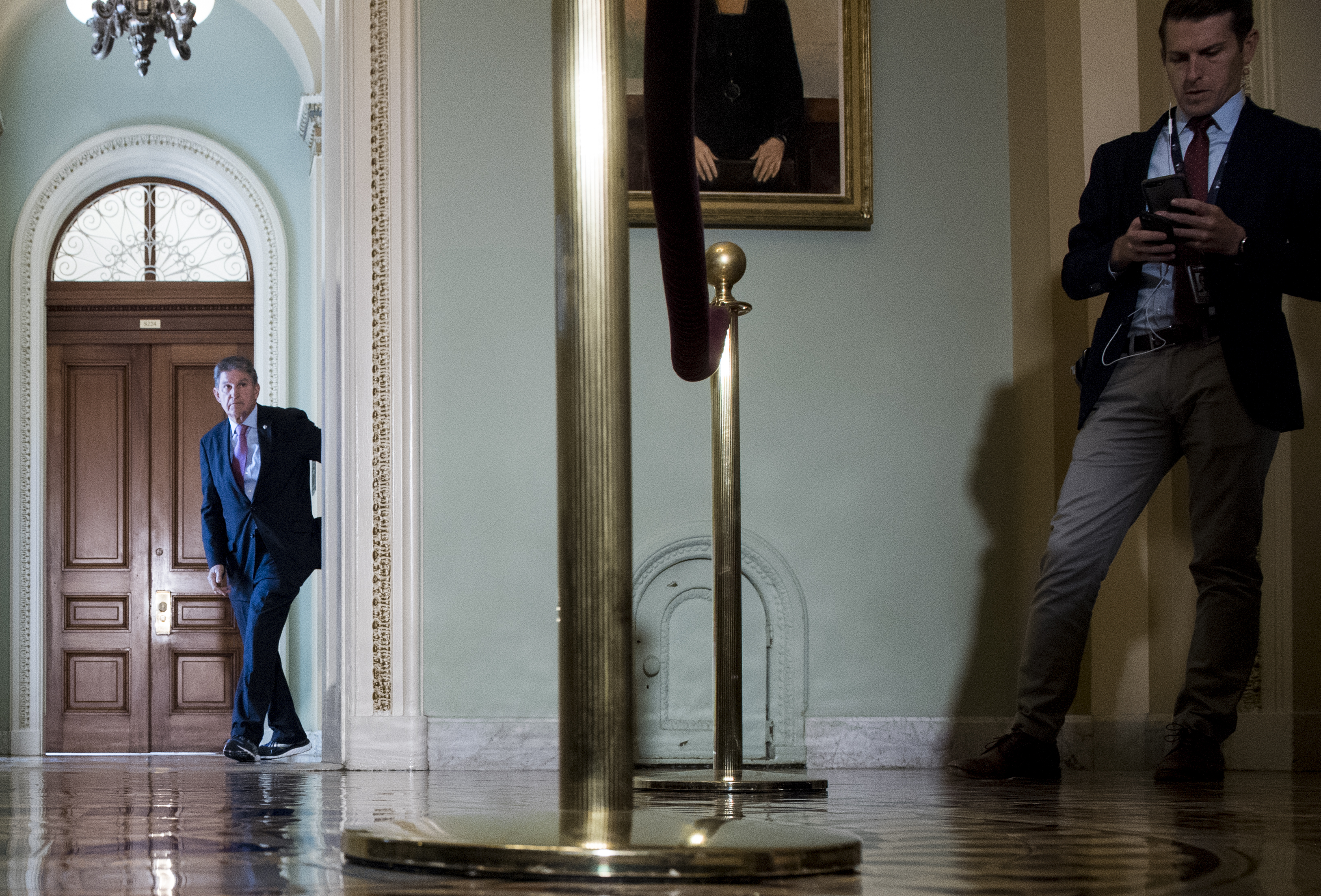 UNITED STATES - SEPTEMBER 25: Sen. Joe Manchin, D-W. Va., accidently walks into the press conference stakeout for Senate Minority Leader Chuck Schumer’s press conference on impeachment in the Capitol on Wednesday, Sept. 25, 2019. (Photo By Bill Clark/CQ Roll Call)