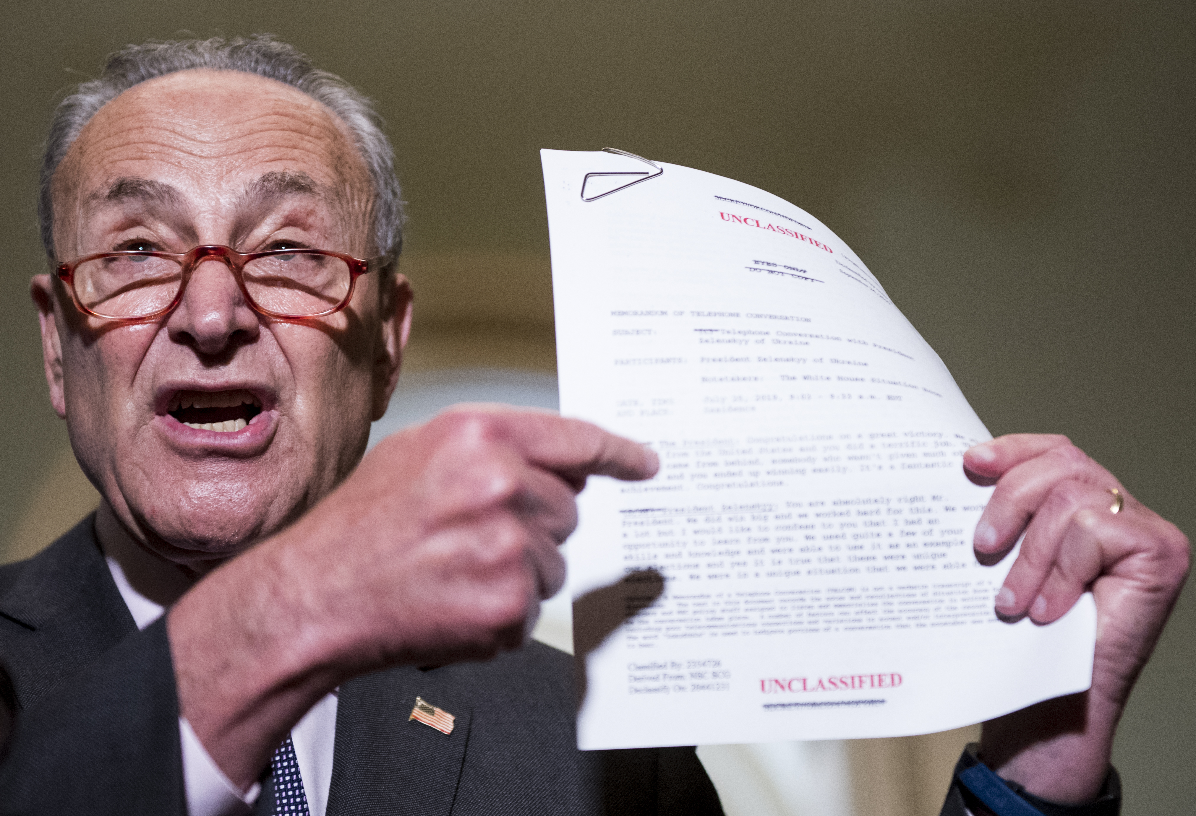 UNITED STATES - SEPTEMBER 25: Senate Minority Leader Chuck Schumer, D-N.Y., holds up a copy of the transcript of President Donald Trump’s phone call with Ukranian President Volodymyr Zelenskiy during his press conference on impeachment in the Capitol on Wednesday, Sept. 25, 2019. (Photo By Bill Clark/CQ Roll Call)