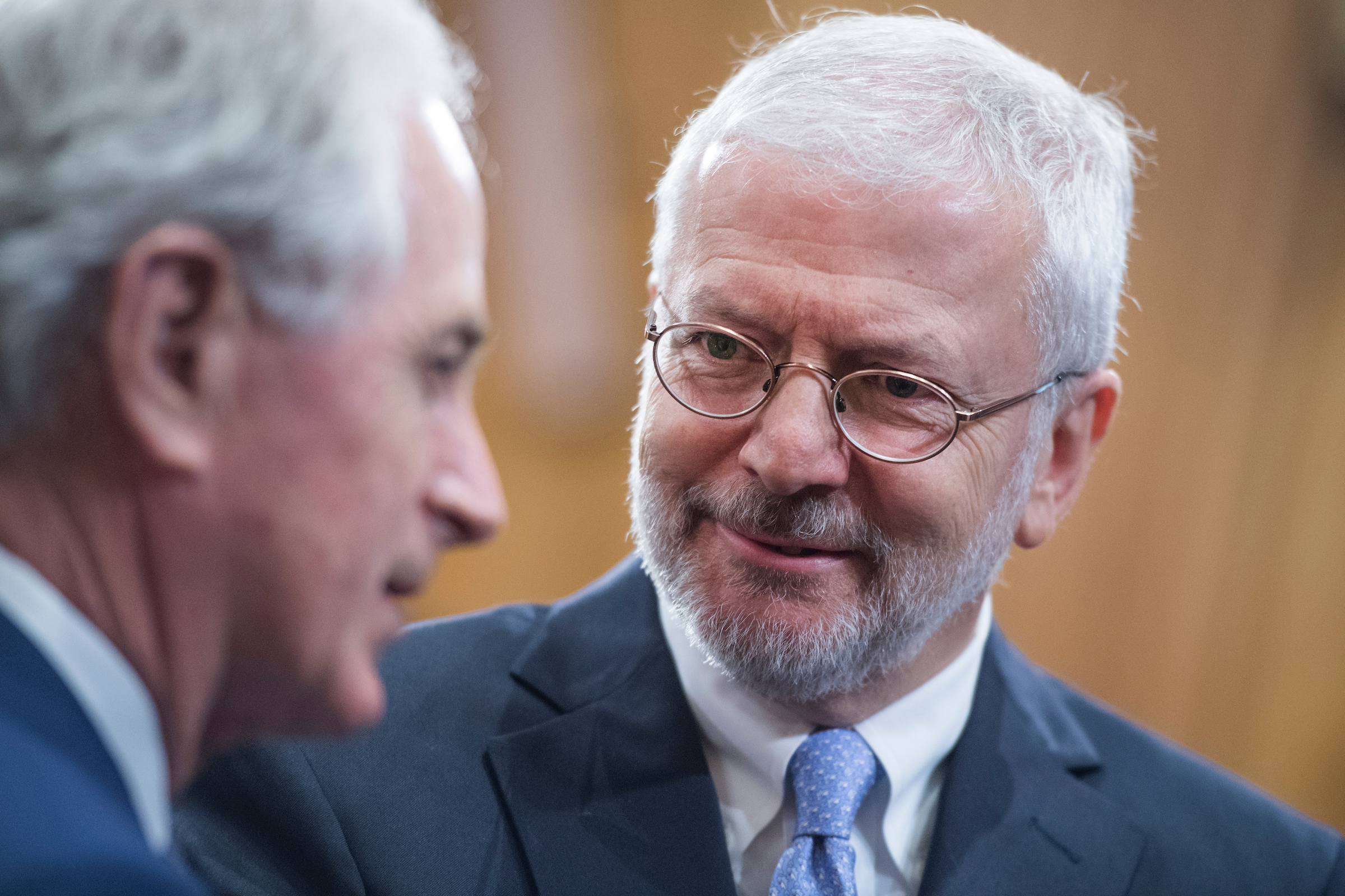 Josh Bolten, right, CEO of the Business Roundtable, talks with Chairman Bob Corker, R-Tenn., after a Senate Foreign Relations Committee hearing in Dirksen Building titled “Tariffs: Implications for U.S. Foreign Policy and the International Economy,” in July of 2018. (Tom Williams/CQ Roll Call file photo)