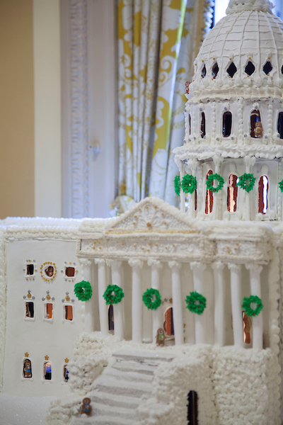 UNITED STATES - NOVEMBER 28. A gingerbread model of the Capitol Buildings displayed outside of the members only dining room in the United States Capitol. (Photo by Margaret Spencer/CQ Roll Call)