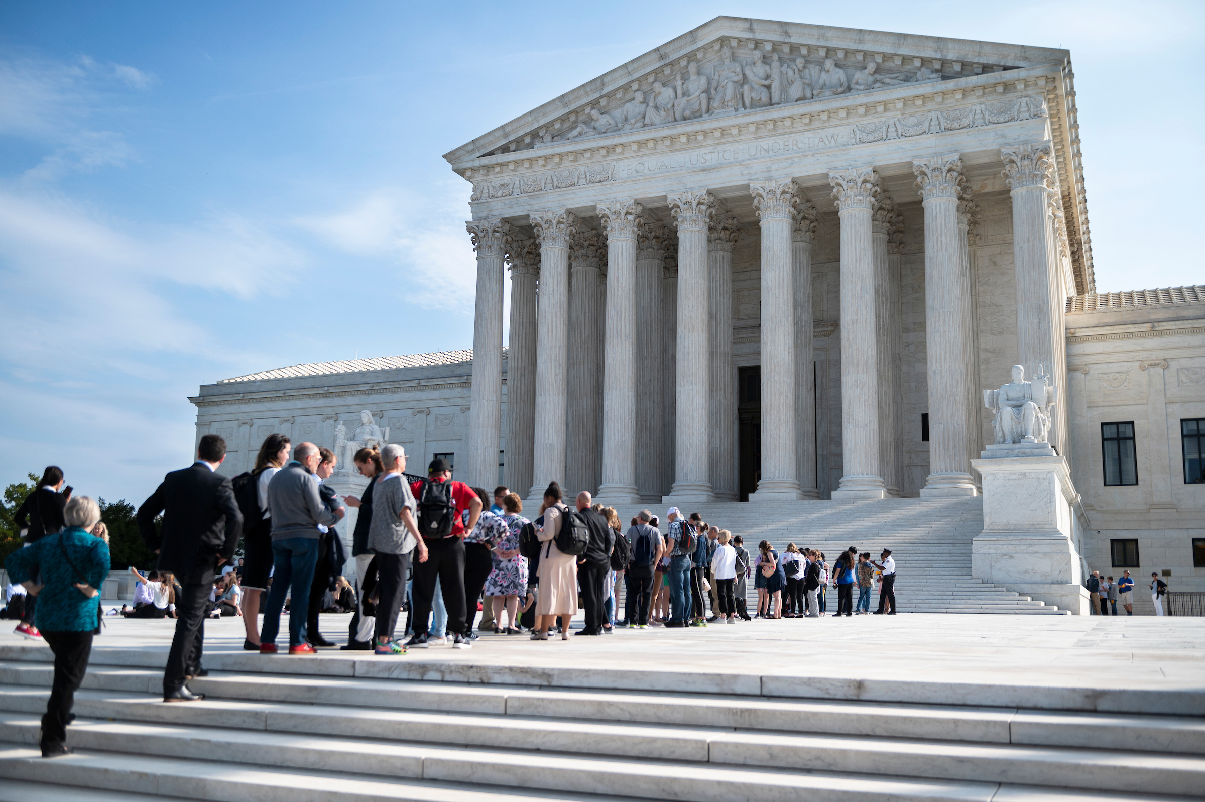 Crowds line up outside the Supreme Court as it resumes oral arguments at the start of its new term on Oct. 7. (Caroline Brehman/CQ Roll Call)