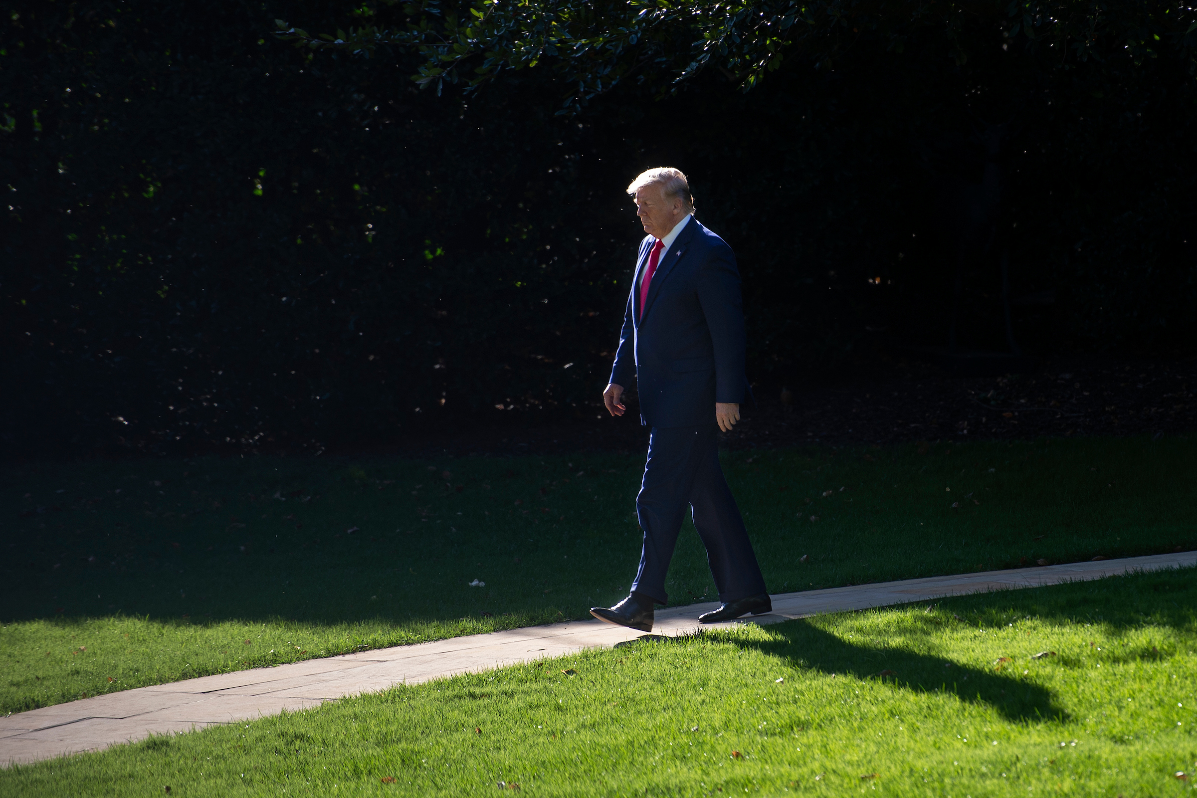 President Donald Trump arrives on the South Lawn of the White House before speaking to members of the media in Washington on Oct. 10. (Caroline Brehman/CQ Roll Call file photo)