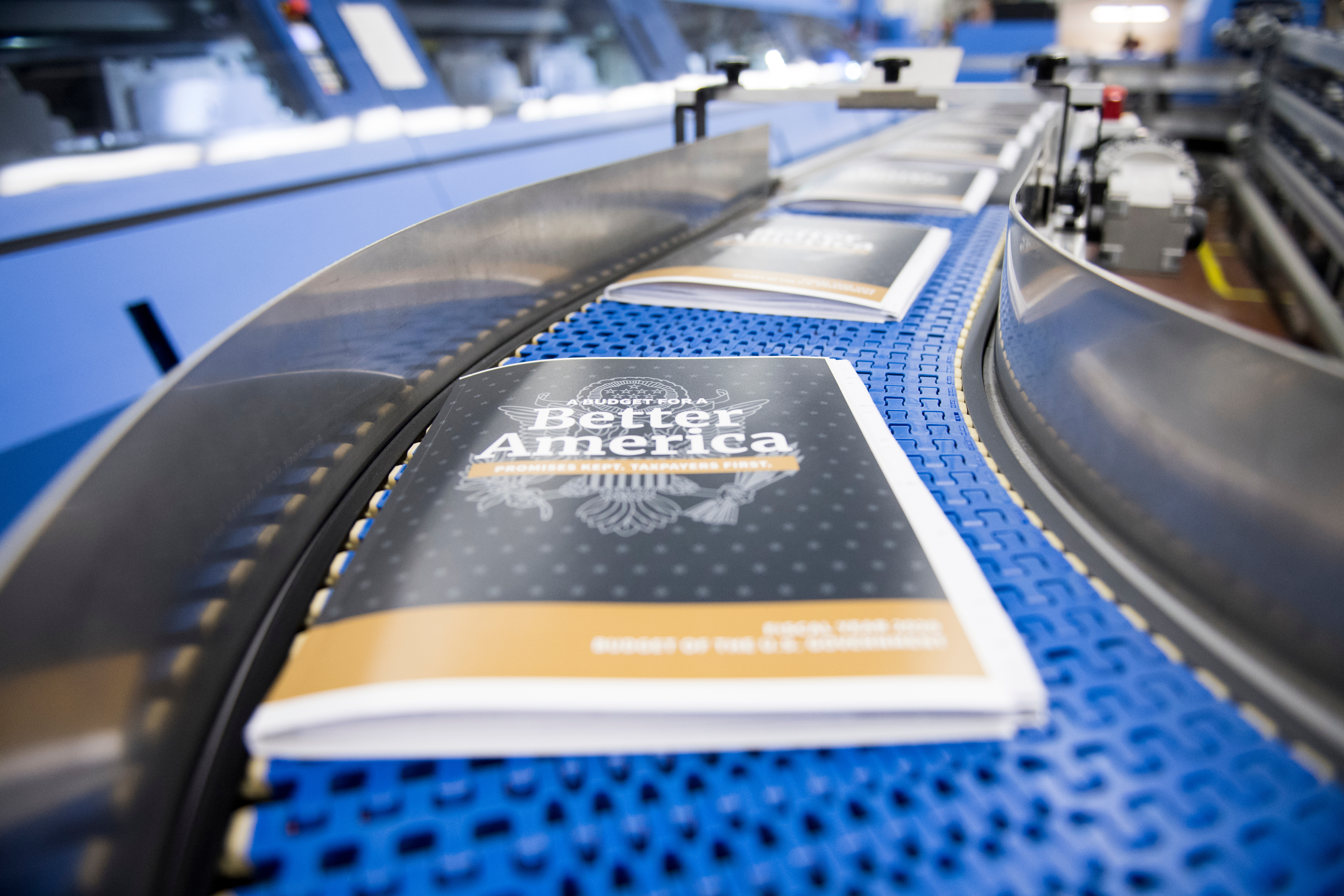 Copies of President Donald Trump's budget for fiscal 2020 run through the binding process at the Government Publishing Office in Washington. Trump nominated Hugh Nathanial Halpern to be director of the agency Tuesday. (Bill Clark/CQ Roll Call file photo)