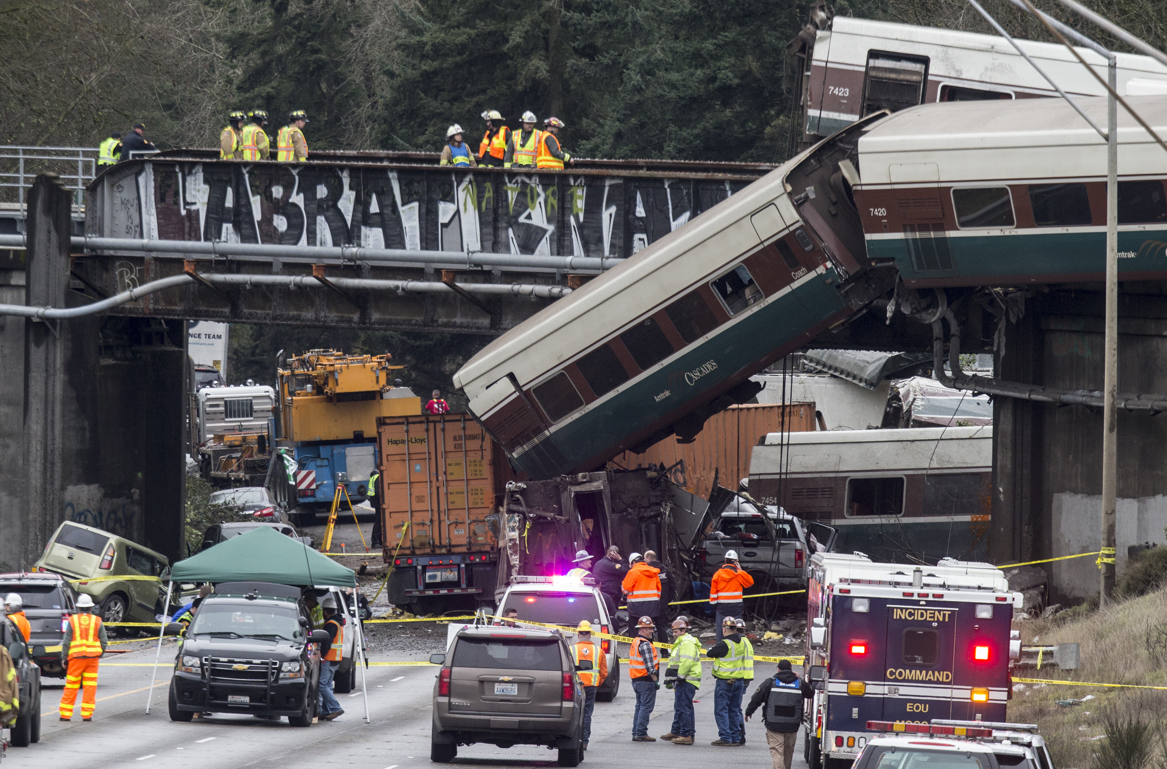 Emergency crews at the scene of an Amtrak train derailment that killed three people in December 2017 near DuPont, Wash. (Photo by Stephen Brashear/Getty Images)