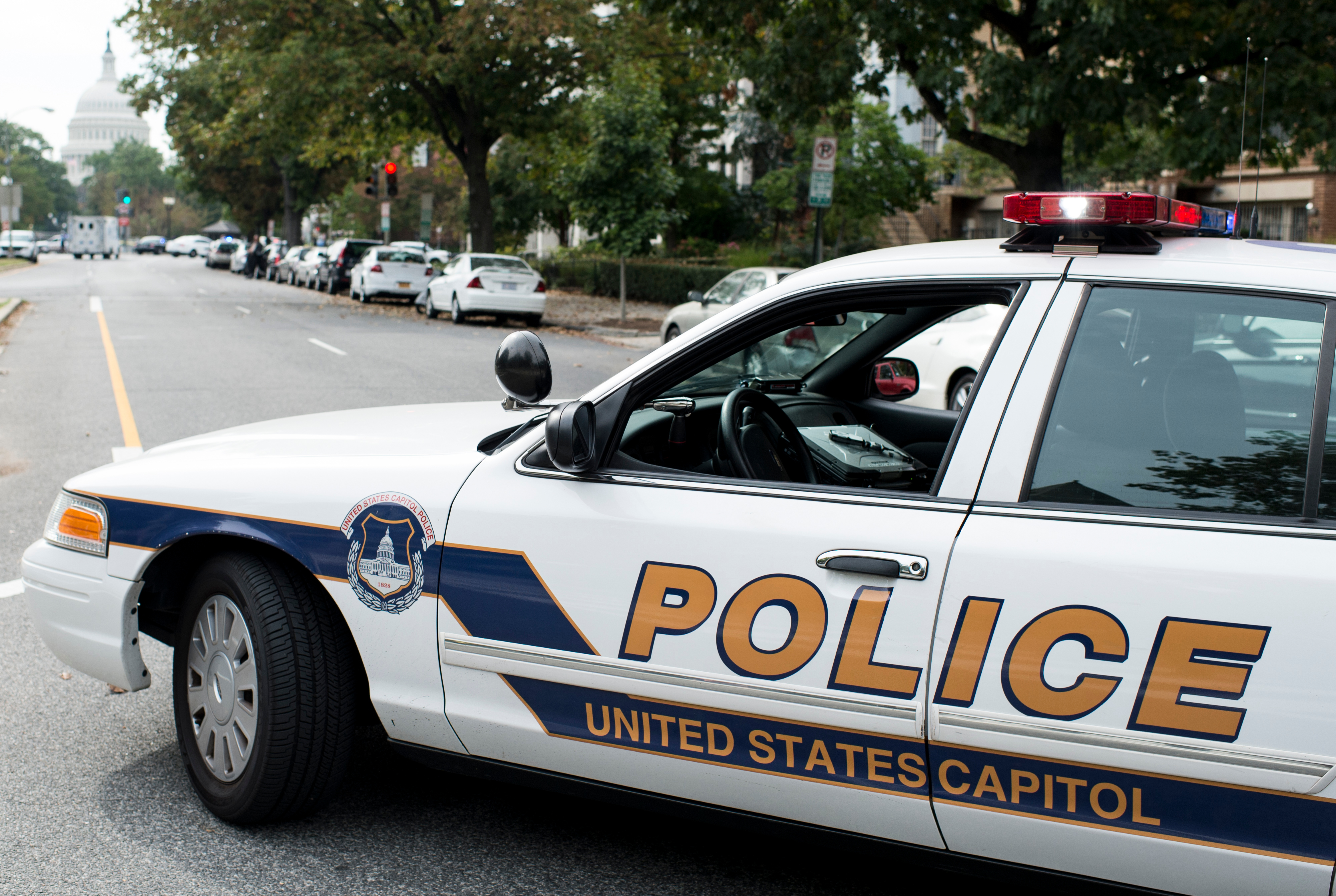 UNITED STATES - OCTOBER 3: A Capitol Police car block Constitution Ave. at 3rd St. NE on Capitol Hill following the shooting outside of the Hart Senate Office Building on Thursday, Oct. 3, 2013. (Photo By Bill Clark/CQ Roll Call)