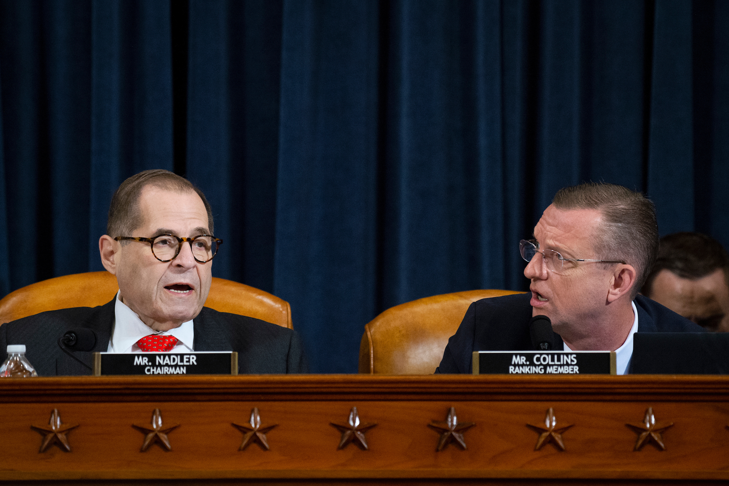 House Judiciary Chairman Jerrold Nadler, D-N.Y., left, and ranking member Rep. Doug Collins, R-Ga., interrupt one another during the House Judiciary Committee hearing on the impeachment articles against President Trump on Thursday. (Caroline Brehman/CQ Roll Call)