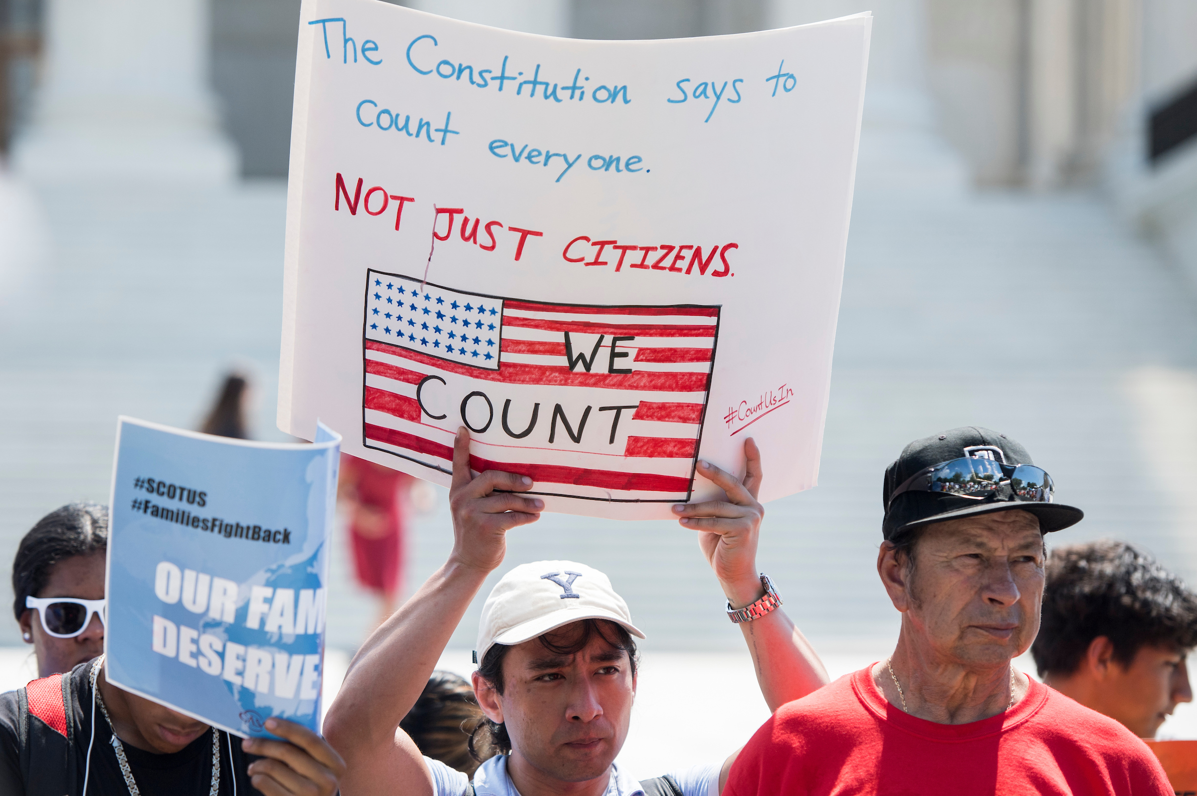 Protesters hold signs at a rally in front of the U.S. Supreme Court after justices blocked the Trump administration from adding a citizenship question to the 2020 Census. (Bill Clark/CQ Roll Call file photo)