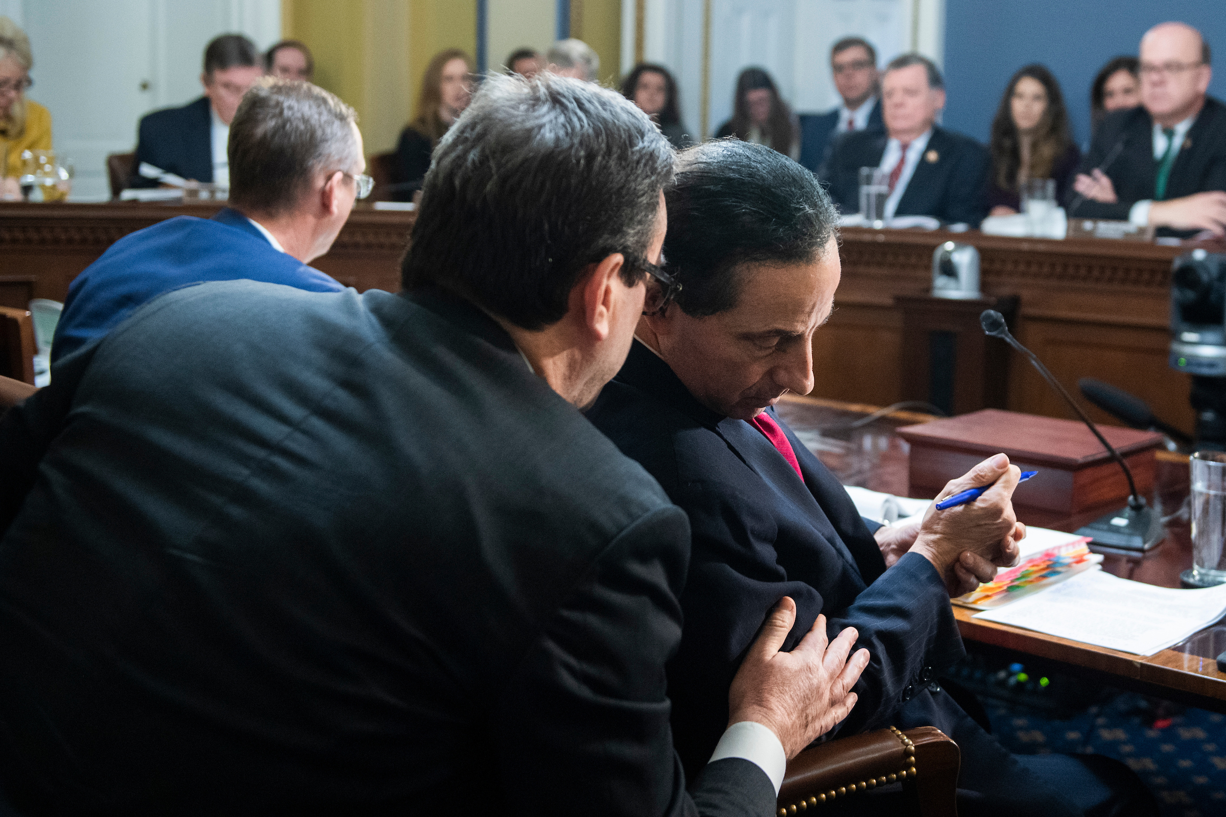 Maryland Democratic Rep. Jamie Raskin, right, a House Judiciary Committee member, confers with counsel Barry Berke during the House Rules Committee markup of articles of impeachment against President Donald Trump on Dec. 17. Judiciary Committee ranking member Doug Collins, R-Ga., is at left. (Tom Williams/CQ Roll Call)