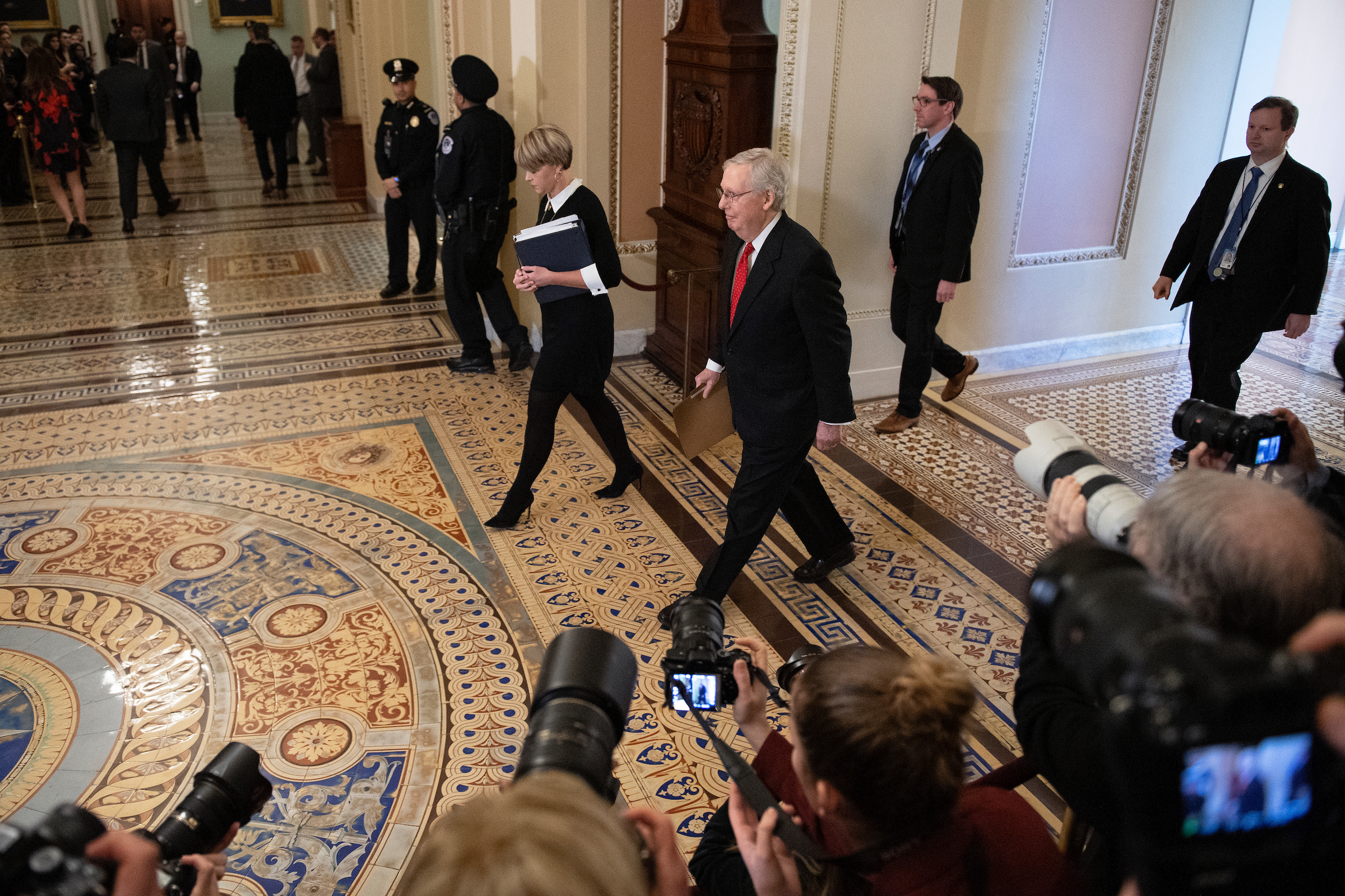 Senate Majority Leader Mitch McConnell, R-Ky., arrives for the start of the impeachment trial on Tuesday. (Caroline Brehman/CQ Roll Call)